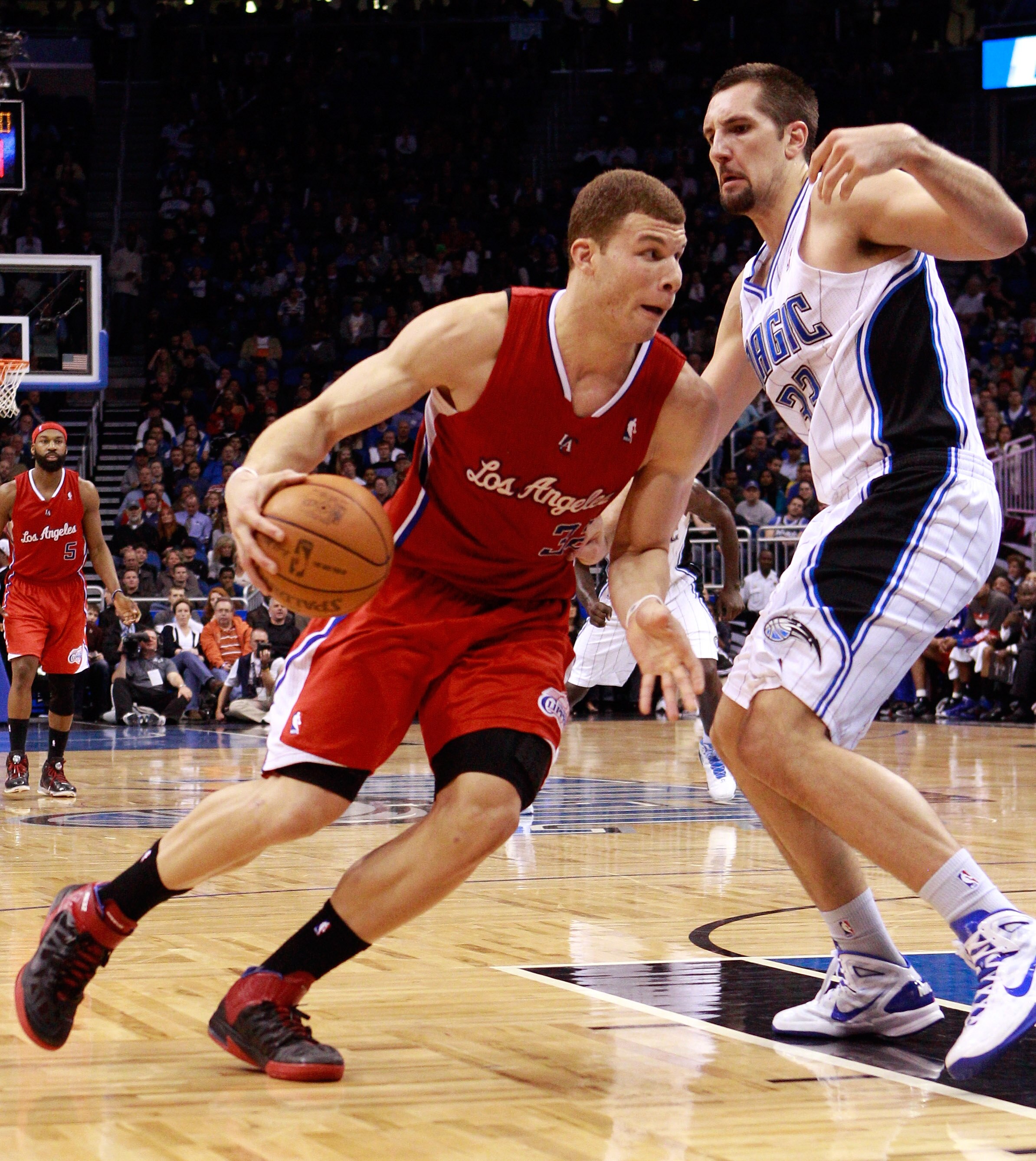 ORLANDO, FL - FEBRUARY 08:  Blake Griffin #32 of the Los Angeles Clippers attempts to drive past Ryan Anderson #33 of the Orlando Magic during the game at Amway Arena on February 8, 2011 in Orlando, Florida.  NOTE TO USER: User expressly acknowledges and