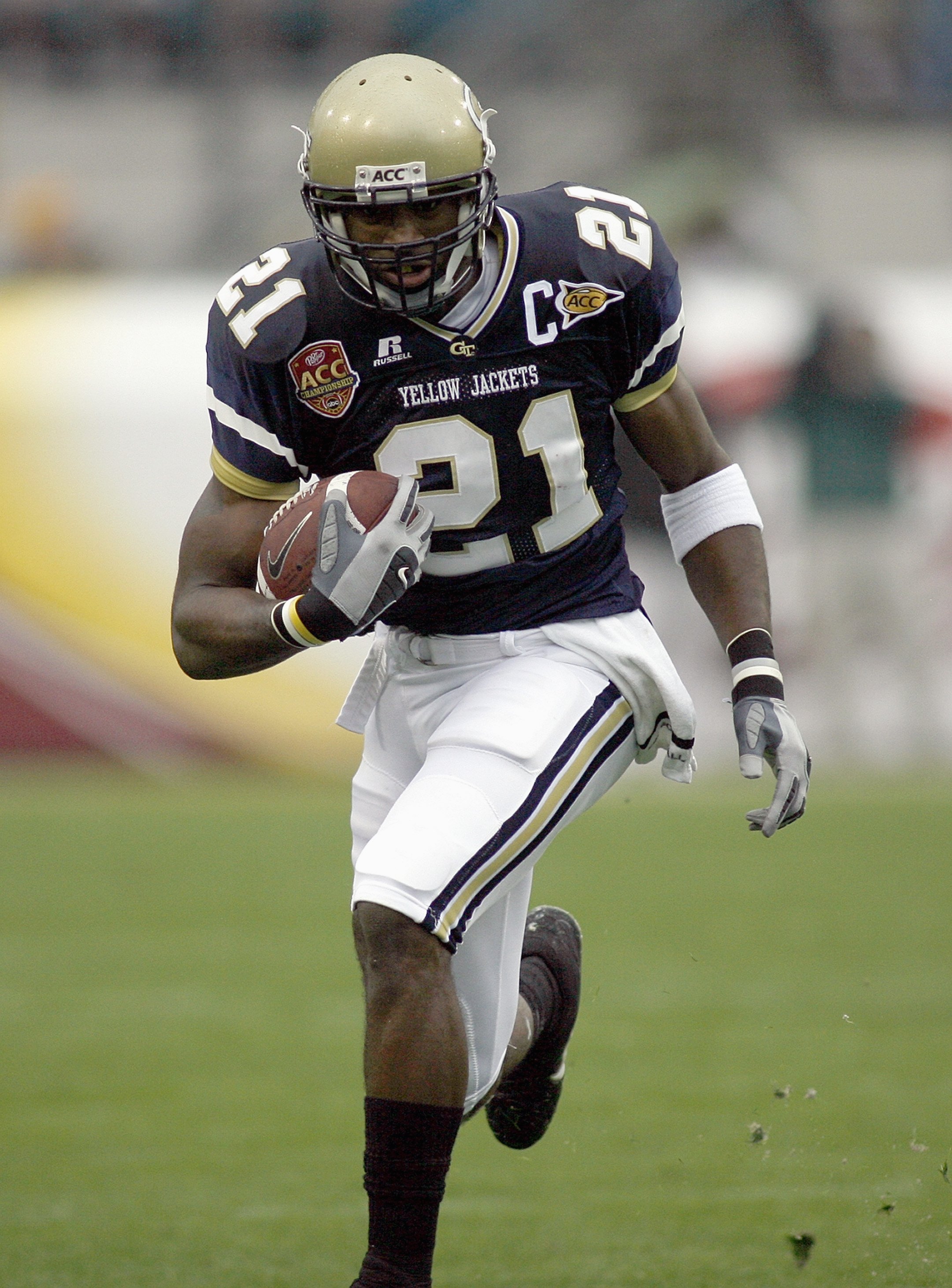 JACKSONVILLE, FL - DECEMBER 02: Calvin Johnson #21 of the Georgia Tech Yellow Jackets carries the ball against the Wake Forest Demon Deacons during the Atlantic Coast Conference Championship on December 2, 2006 at Alltel Stadium in Jacksonville, Florida.