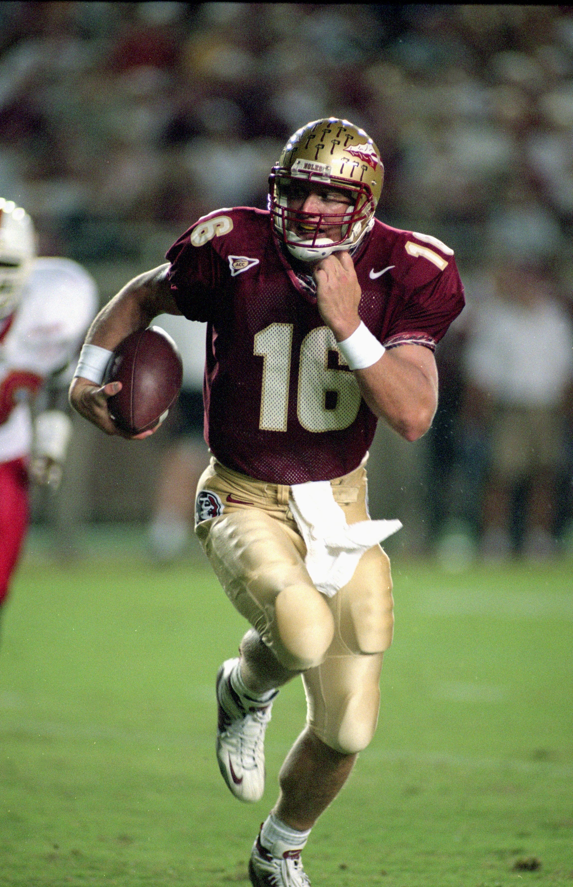 23 Sep 2000:  Quarterback Chris Weinke #16 of the Florida State Seminoles scrambles with the ball during the game against the Louisville Cardinals at the Doke Campbell Stadium in Talahassee, Florida. The Seminoles defeated the Cardinals 31-0.Mandatory Cre
