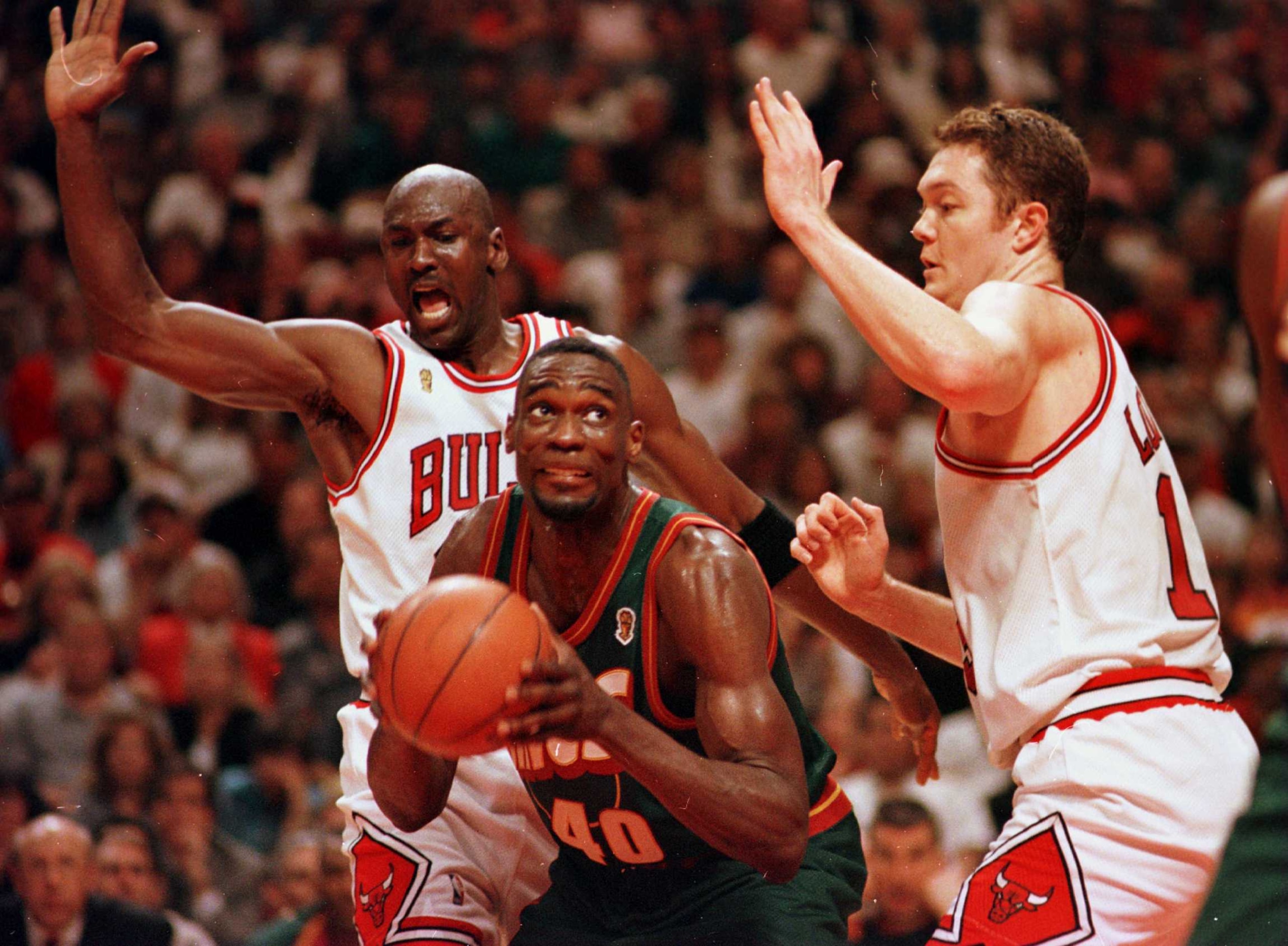 16 Jun 1996: Seattle Supersonic Shawn Kemp works to the basket between Chicago Bulls Michael Jordan and Luc Longley during fourth quarter action of game six of the NBA Finals at the United Center in Chicago, Illinois. The Bulls went on to defeat the Seatt 16 Jun 1996: Seattle Supersonic Shawn Kemp works to the basket between Chicago Bulls Michael Jordan and Luc Longley during fourth quarter action of game six of the NBA Finals at the United Center in Chicago, Illinois. The Bulls went on to defeat the Seatt