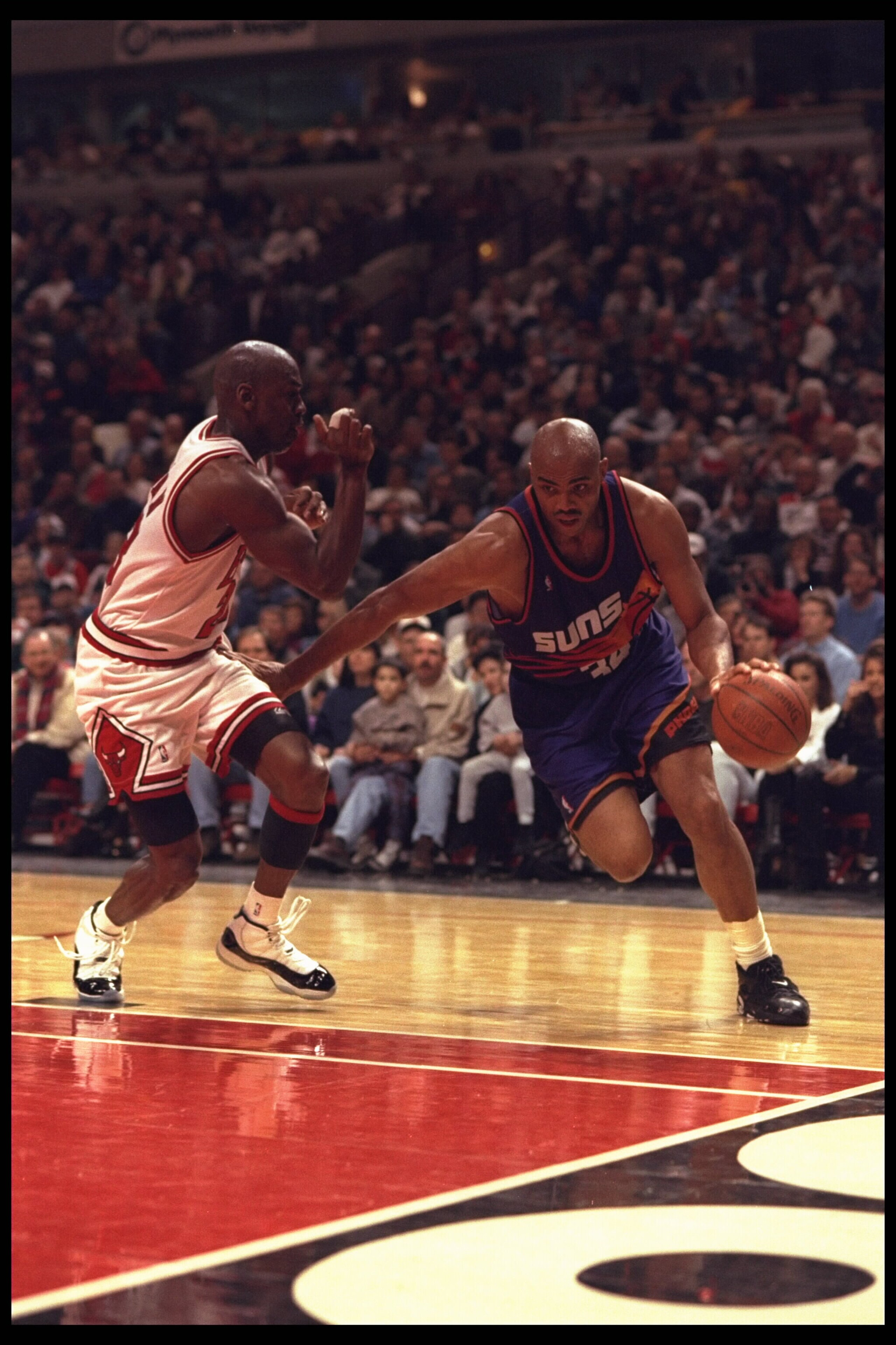 28 Jan 1996: Forward Charles Barkley #34 of the Phoenix Suns drives hard around Chicago Bull defender guard Michael Jordan #23 at the United Center in Chicago, Illinois. The Bulls defeated the Suns 93-82. Mandatory Credit: Jonathan Daniel/Allsport 28 Jan 1996: Forward Charles Barkley #34 of the Phoenix Suns drives hard around Chicago Bull defender guard Michael Jordan #23 at the United Center in Chicago, Illinois. The Bulls defeated the Suns 93-82. Mandatory Credit: Jonathan Daniel/Allsport