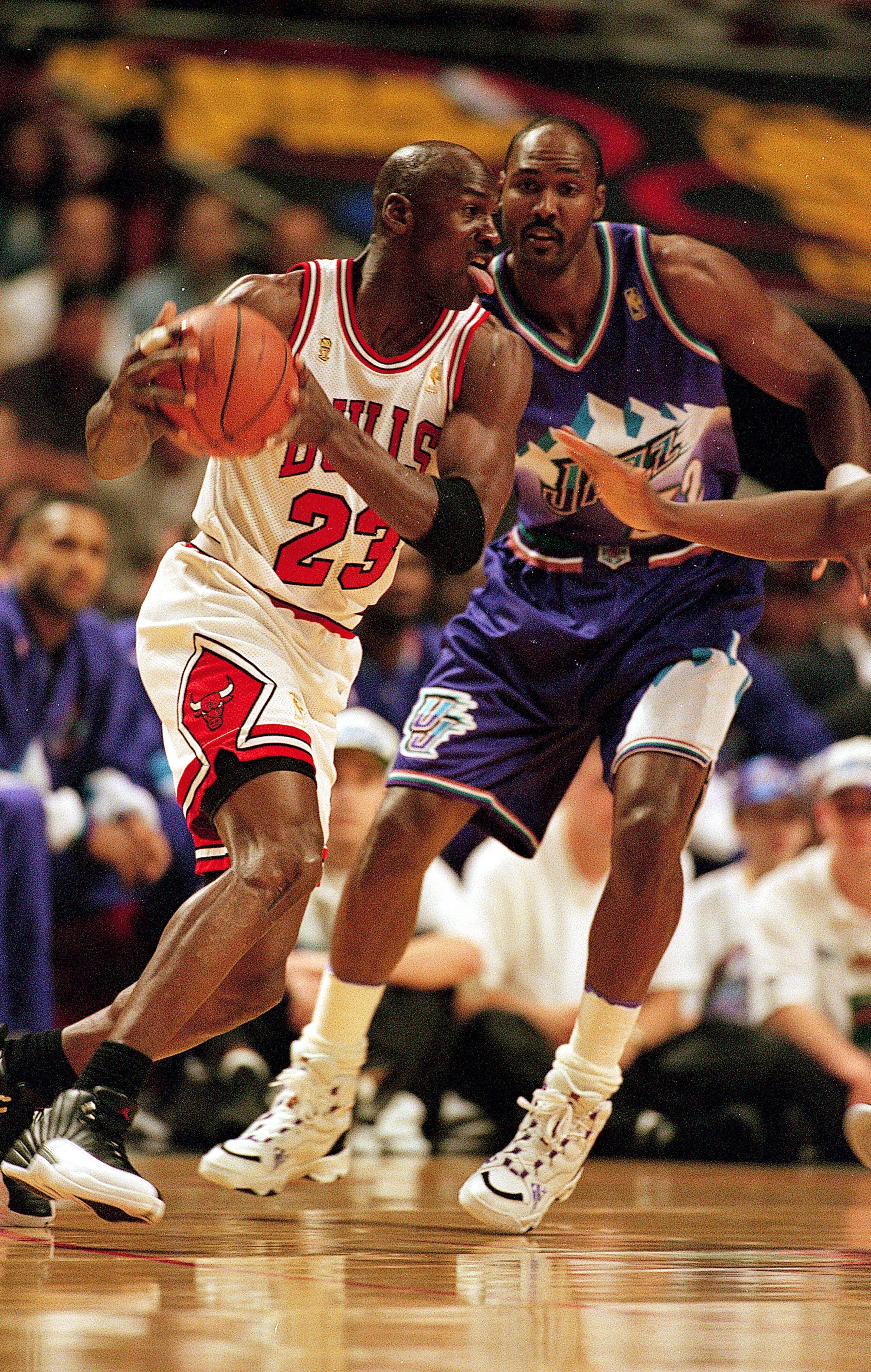 I3 Jun 1997: Michael Jordan #23 of the Chicago Bulls dribbles the ball as he is guarded by Karl Malone #32 of the Utah Jazz during game six of the NBA Final at the United Center in Chicago, Illinois. The Bulls defeated the Jazz 90-86.. Mandatory Credit I3 Jun 1997: Michael Jordan #23 of the Chicago Bulls dribbles the ball as he is guarded by Karl Malone #32 of the Utah Jazz during game six of the NBA Final at the United Center in Chicago, Illinois. The Bulls defeated the Jazz 90-86.. Mandatory Credit