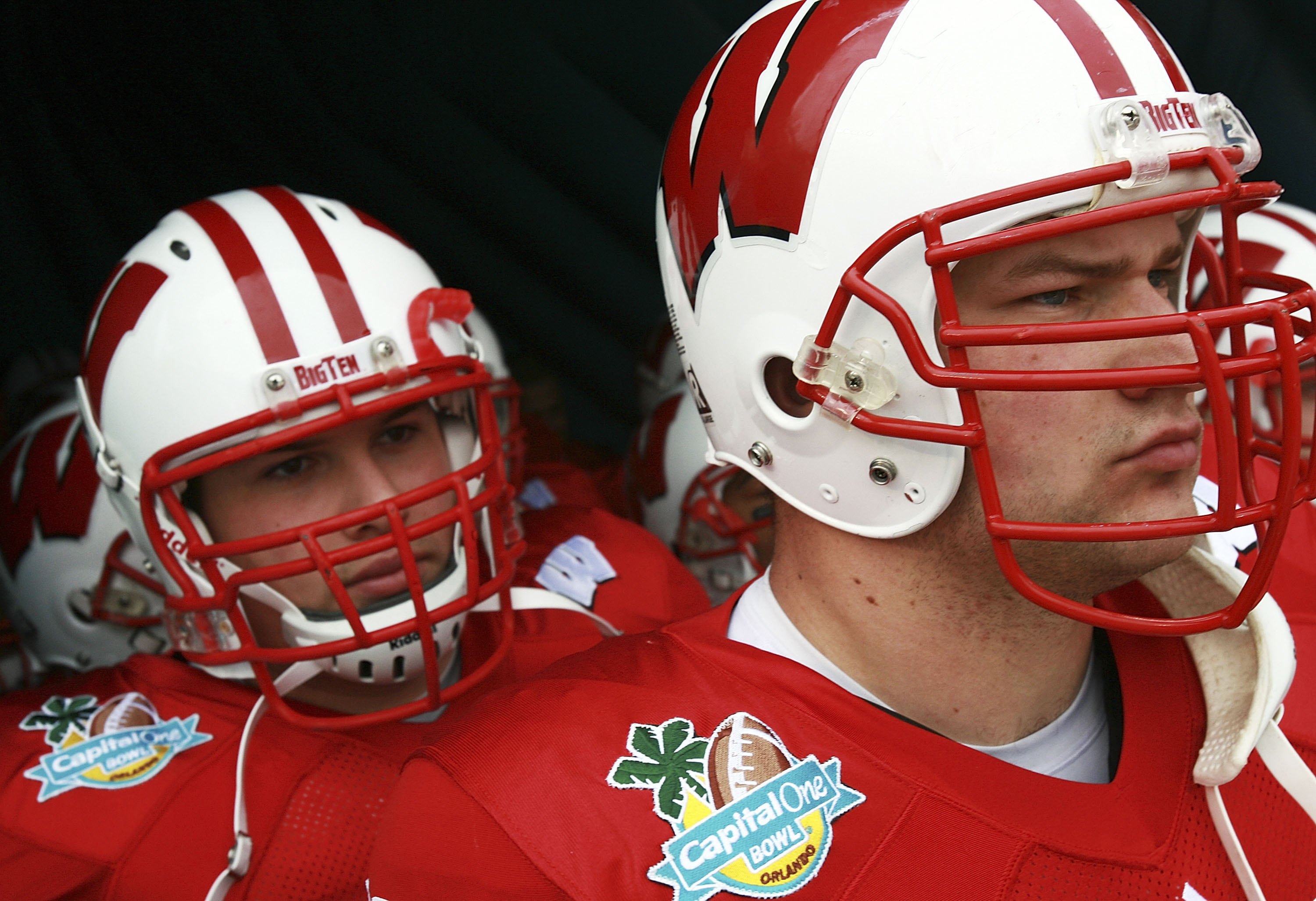 ORLANDO, FL - JANUARY 1:  Joe Thomas #72 and Kraig Urbik #63 of the Wisconsin Badgers prepare to lead their team onto the field to take on the Arkansas Razorbacks in the Capitol One Bowl at Florida Citrus Bowl January 1, 2007 in Orlando, Florida. Wisconsi