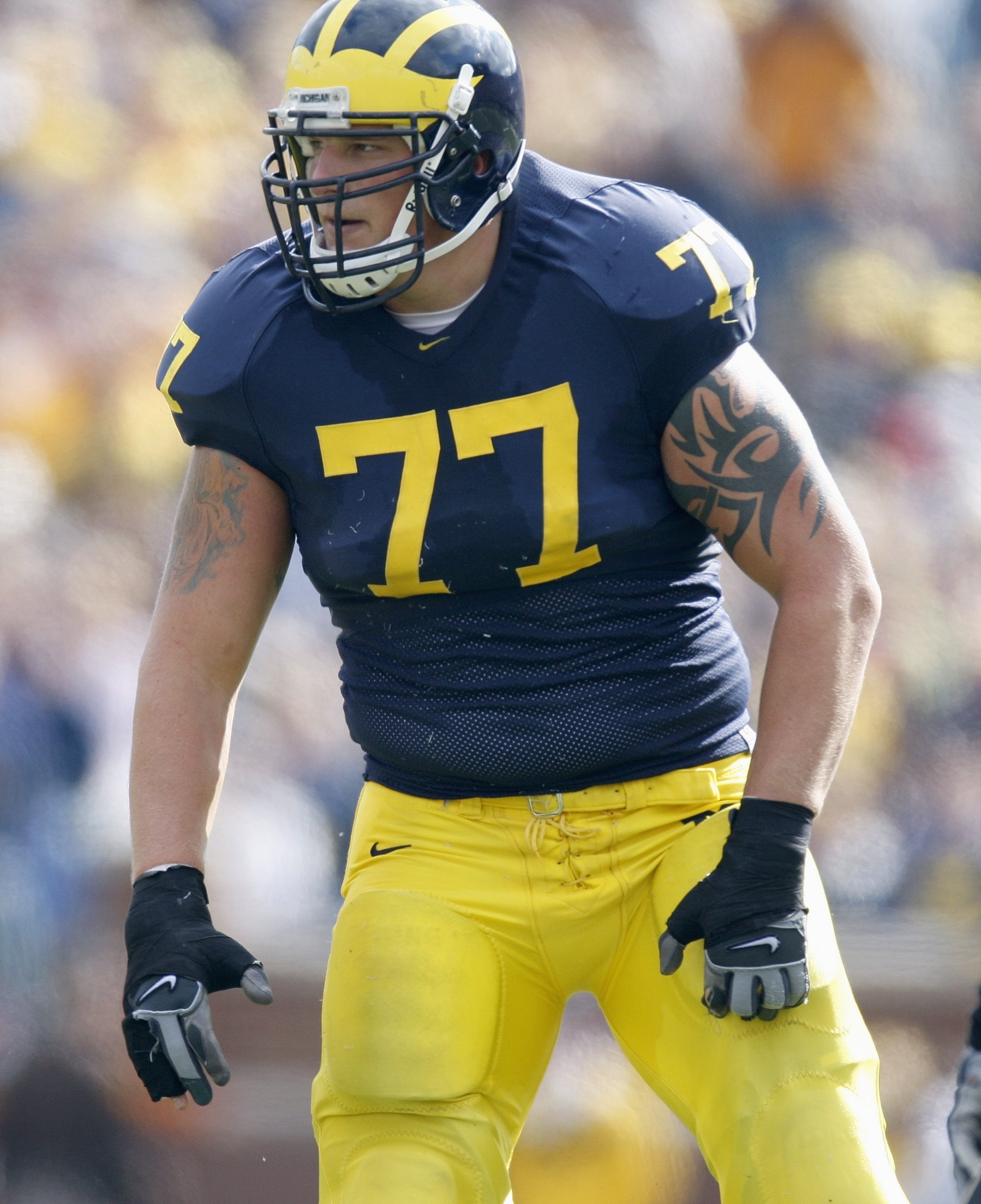 ANN ARBOR, MI - OCTOBER 13: Jake Long #77 of the Michigan Wolverines gets ready on the field during the game against the Purdue Boilermakers on October 13, 2007 at Michigan Stadium in Ann Arbor, Michigan. (Photo By Gregory Shamus/Getty Images)