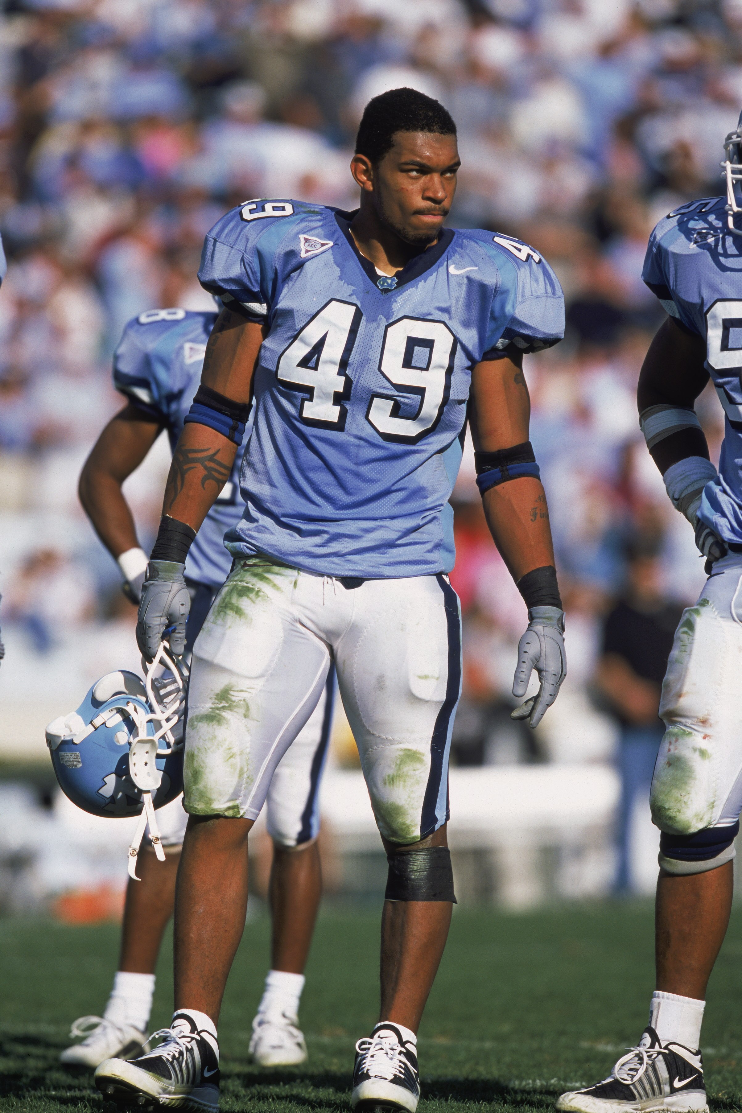 10 Nov 2001:  Defensive End Julius Peppers #49 of the North Carolina (UNC) Tar Heels holding hishelmet while standing on the field during the game against the Wake Forest Demon Deacons at the Kenan Stadium in Chapel Hill, North Carolina. The Demon Deacons
