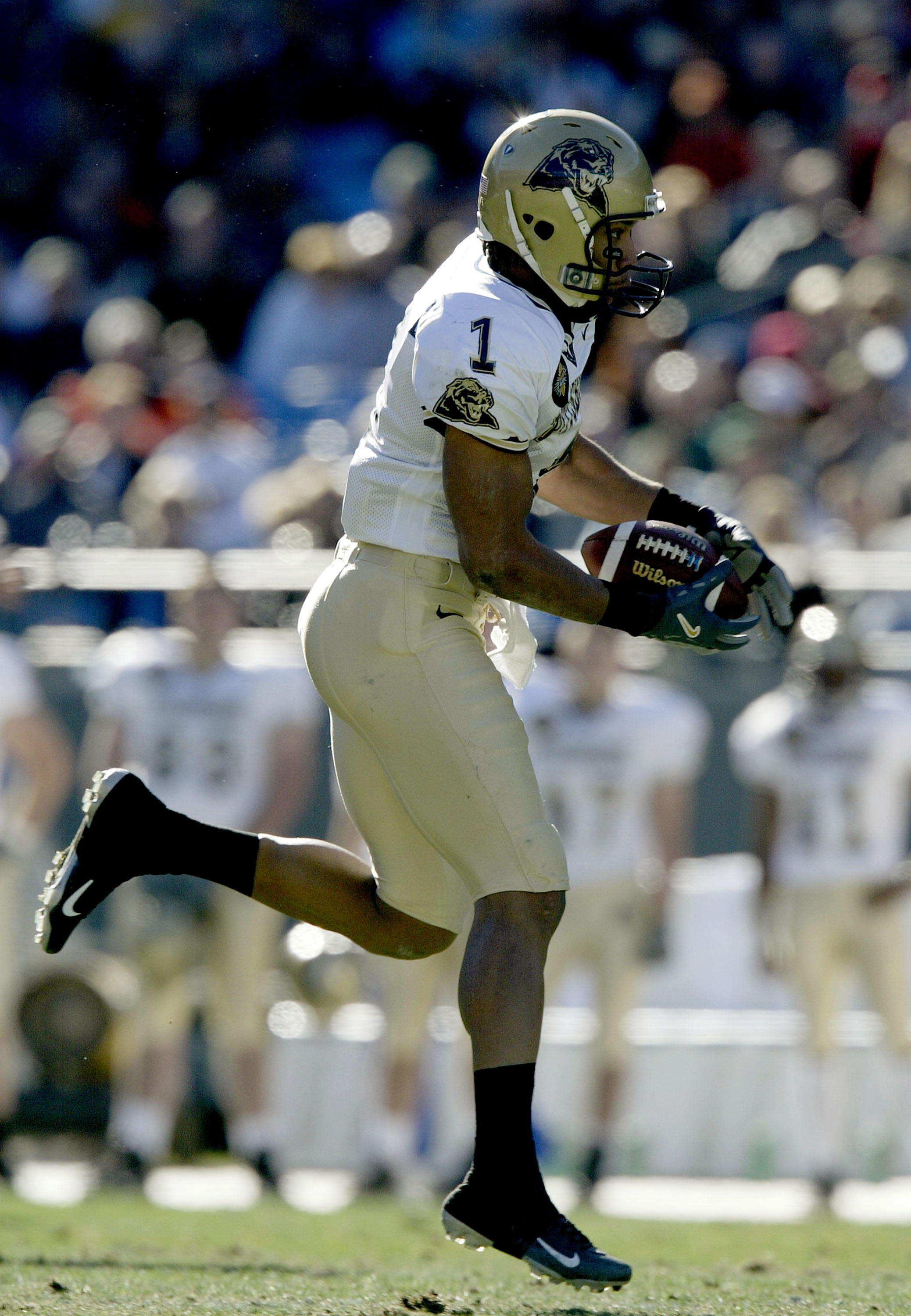 CHARLOTTE, NC - DECEMBER 27:  Larry Fitzgerald #1 of the Pittsburgh Panthers catches a pass against the Virginia Cavaliers during the Continental Tire Bowl December 27, 2003 at Ericsson Stadium in Charlotte, North Carolina.  (Photo by Craig Jones/Getty Im