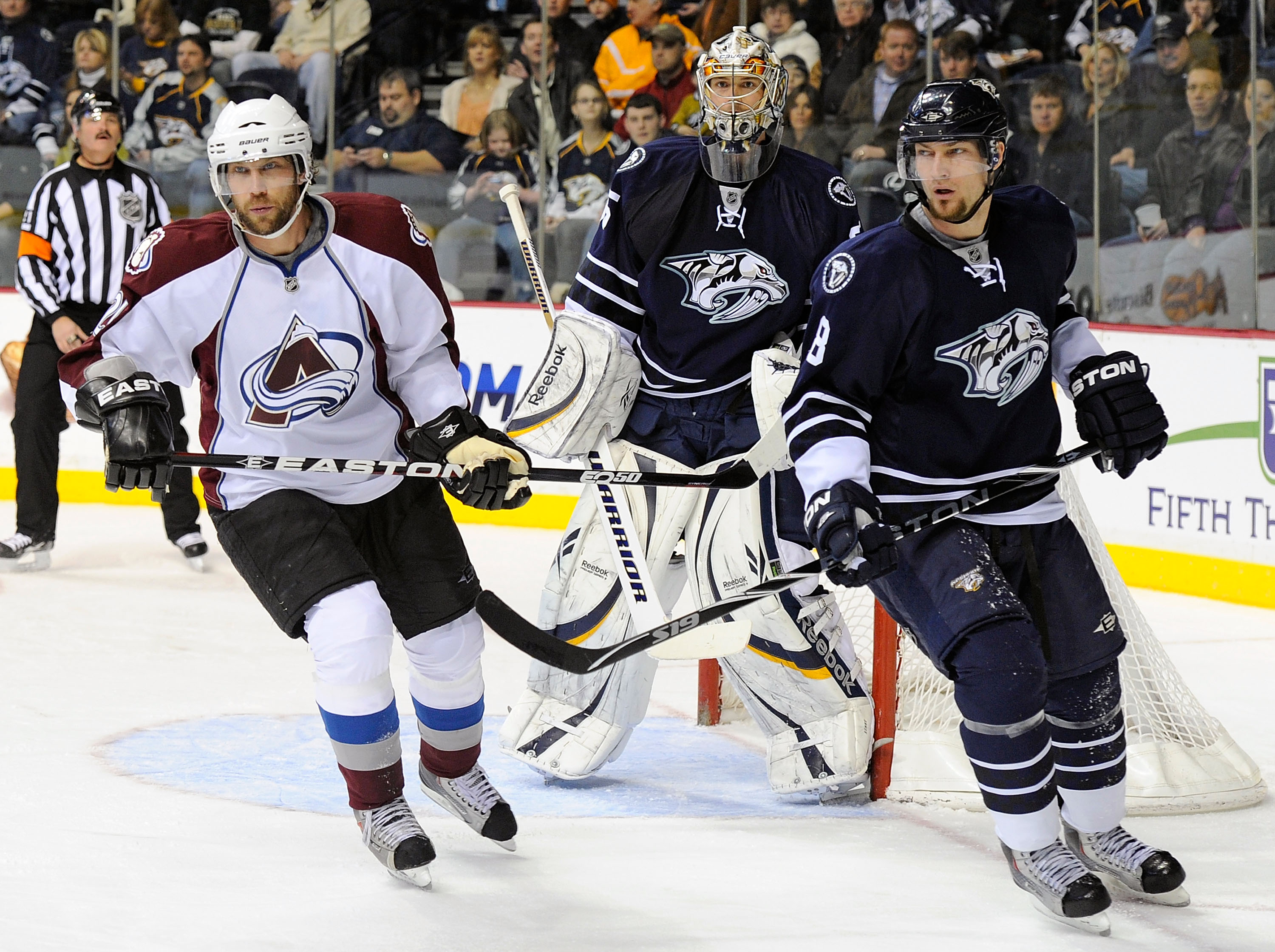 NASHVILLE, TN - FEBRUARY 12:  Peter Forsberg #21 of the Colorado Avalanche and Kevin Klein #8 of the Nashville Predators skate in front of Predators goalie Pekka Rinne #35 on February 12, 2011 at the Bridgestone Arena in Nashville, Tennessee.  (Photo by F