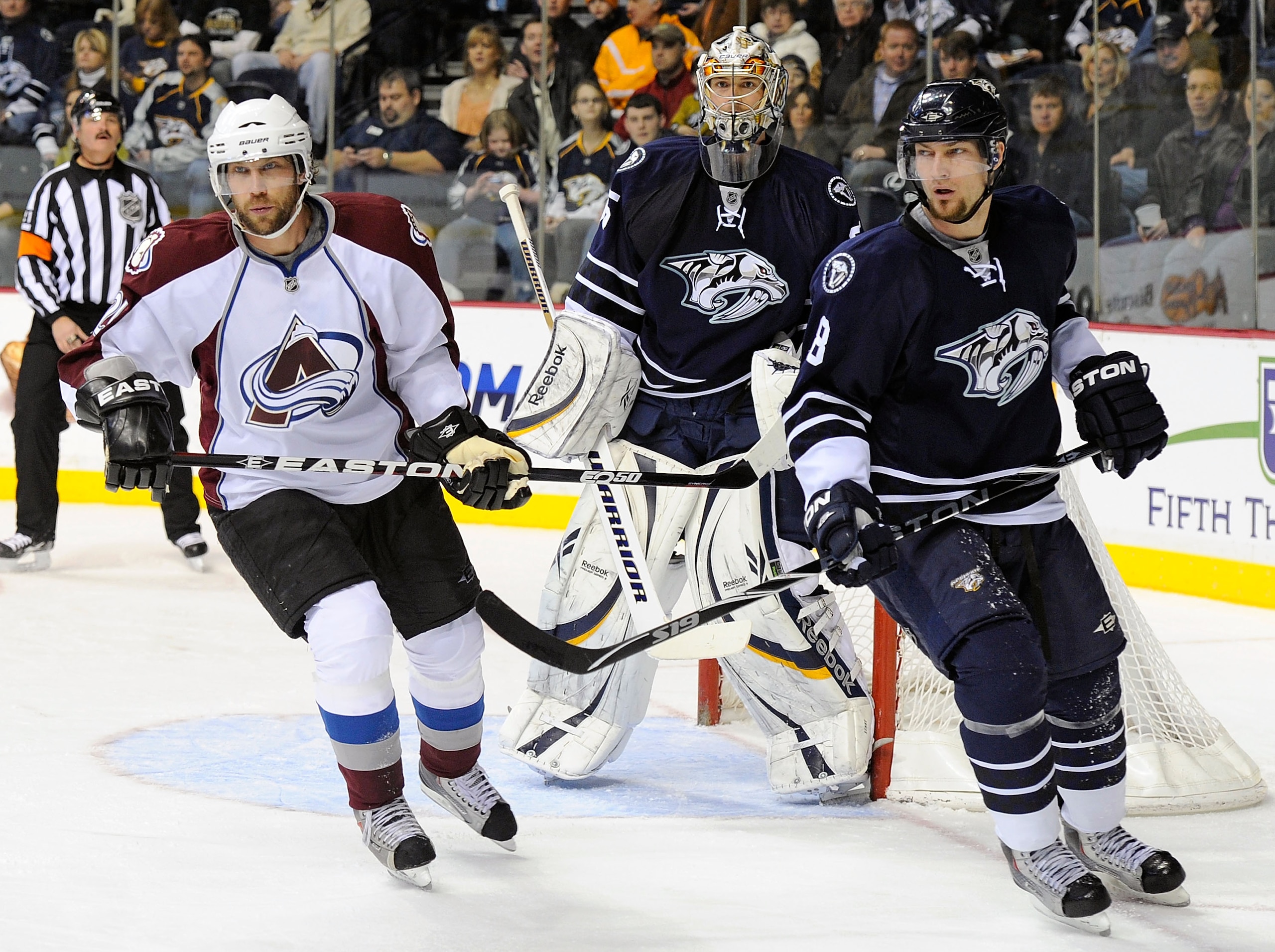 NASHVILLE, TN - FEBRUARY 12:  Peter Forsberg #21 of the Colorado Avalanche and Kevin Klein #8 of the Nashville Predators skate in front of Predators goalie Pekka Rinne #35 on February 12, 2011 at the Bridgestone Arena in Nashville, Tennessee.  (Photo by F