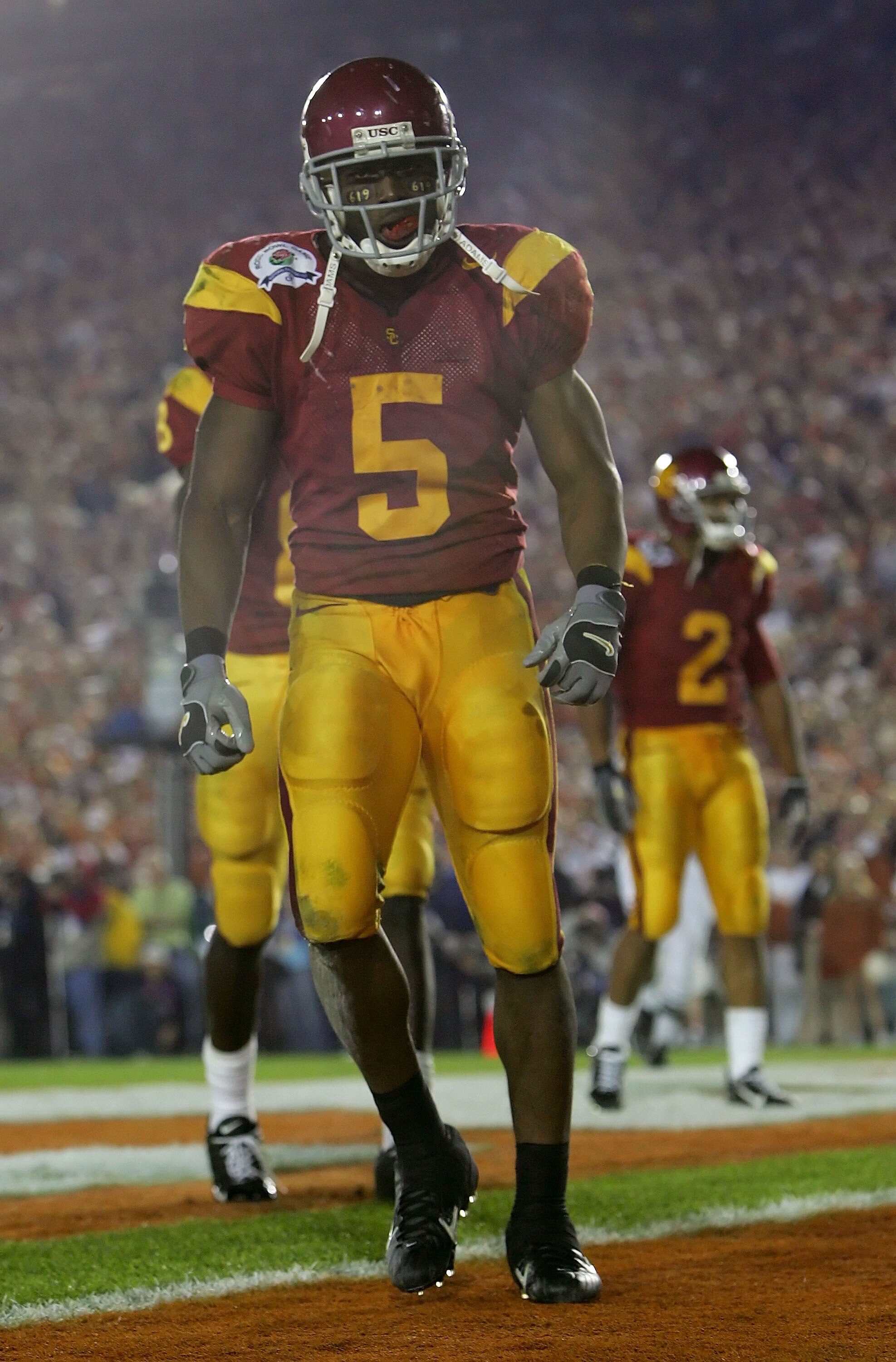 PASADENA, CA - JANUARY 04:  Reggie Bush #5 of the USC Trojans stands in the end zone after scoring a 26 yard touchdown in the fourth quarter of the BCS National Championship Rose Bowl Game against the Texas Longhorns at the Rose Bowl on January 4, 2006 in