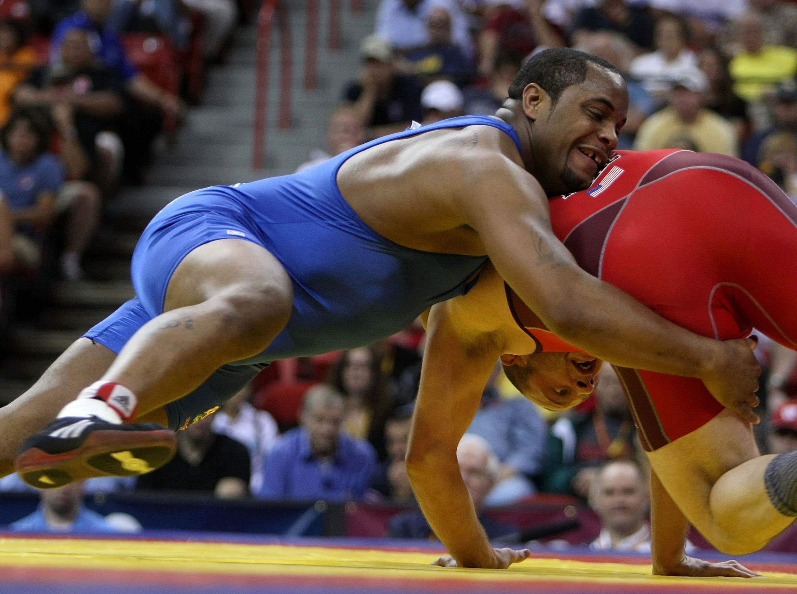 LAS VEGAS - JUNE 15:  Daniel Cormier (blue) takes down Damion Hahn (red) in the Freestyle 96kg division championship match during the USA Olympic trials for wrestling and judo on June 15, 2008 at the Thomas & Mack Center in Las Vegas, Neveda.  (Photo by J