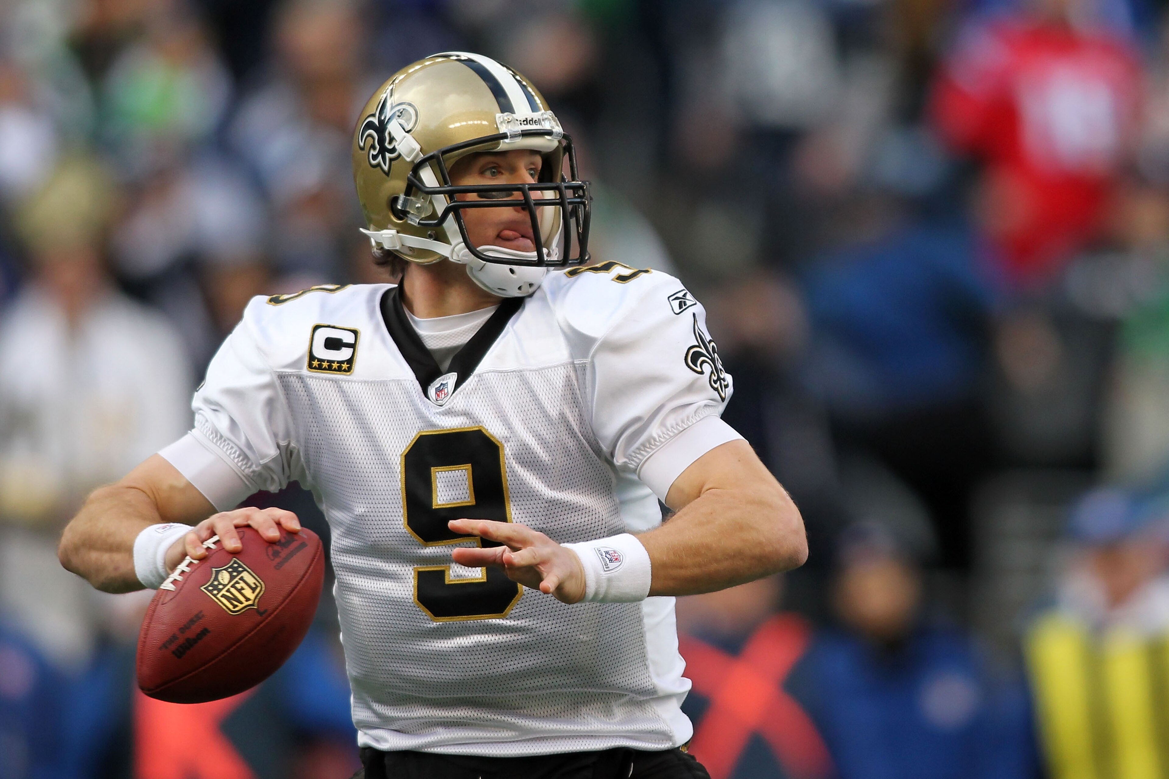 SEATTLE, WA - JANUARY 08: Quarterback Drew Brees #9 of the New Orleans Saints scrambles against the Seattle Seahawks during the 2011 NFC wild-card playoff game at Qwest Field on January 8, 2011 in Seattle, Washington. (Photo by Jonathan Ferrey/Getty Ima SEATTLE, WA - JANUARY 08: Quarterback Drew Brees #9 of the New Orleans Saints scrambles against the Seattle Seahawks during the 2011 NFC wild-card playoff game at Qwest Field on January 8, 2011 in Seattle, Washington. (Photo by Jonathan Ferrey/Getty Ima