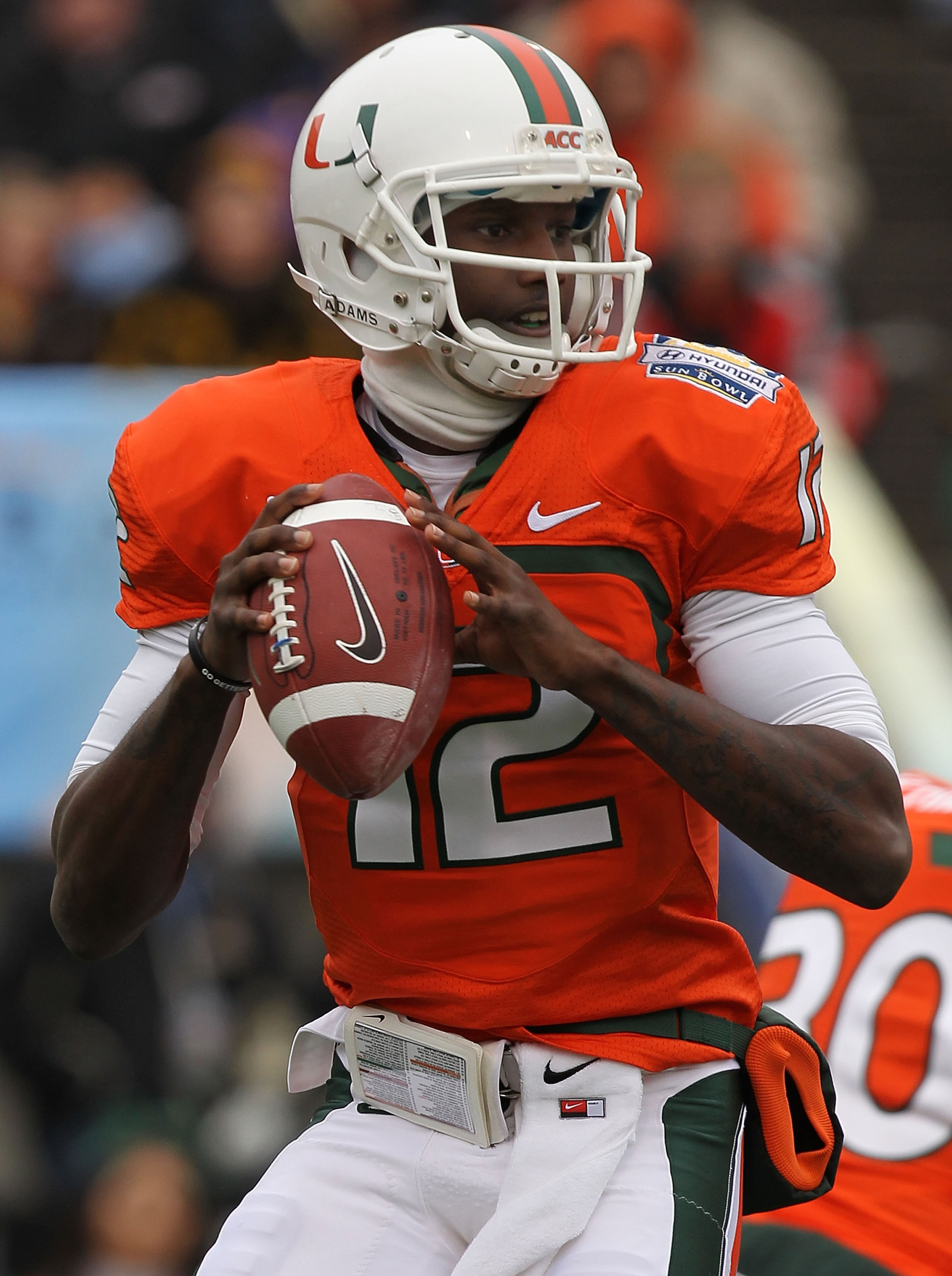 EL PASO, TX - DECEMBER 30:  Quarterback Jacory Harris #12 of the Miami Hurricanes throws against the Notre Dame Fighting Irish during the Hyundai Sun Bowl at Sun Bowl on December 30, 2010 in El Paso, Texas.  (Photo by Ronald Martinez/Getty Images)