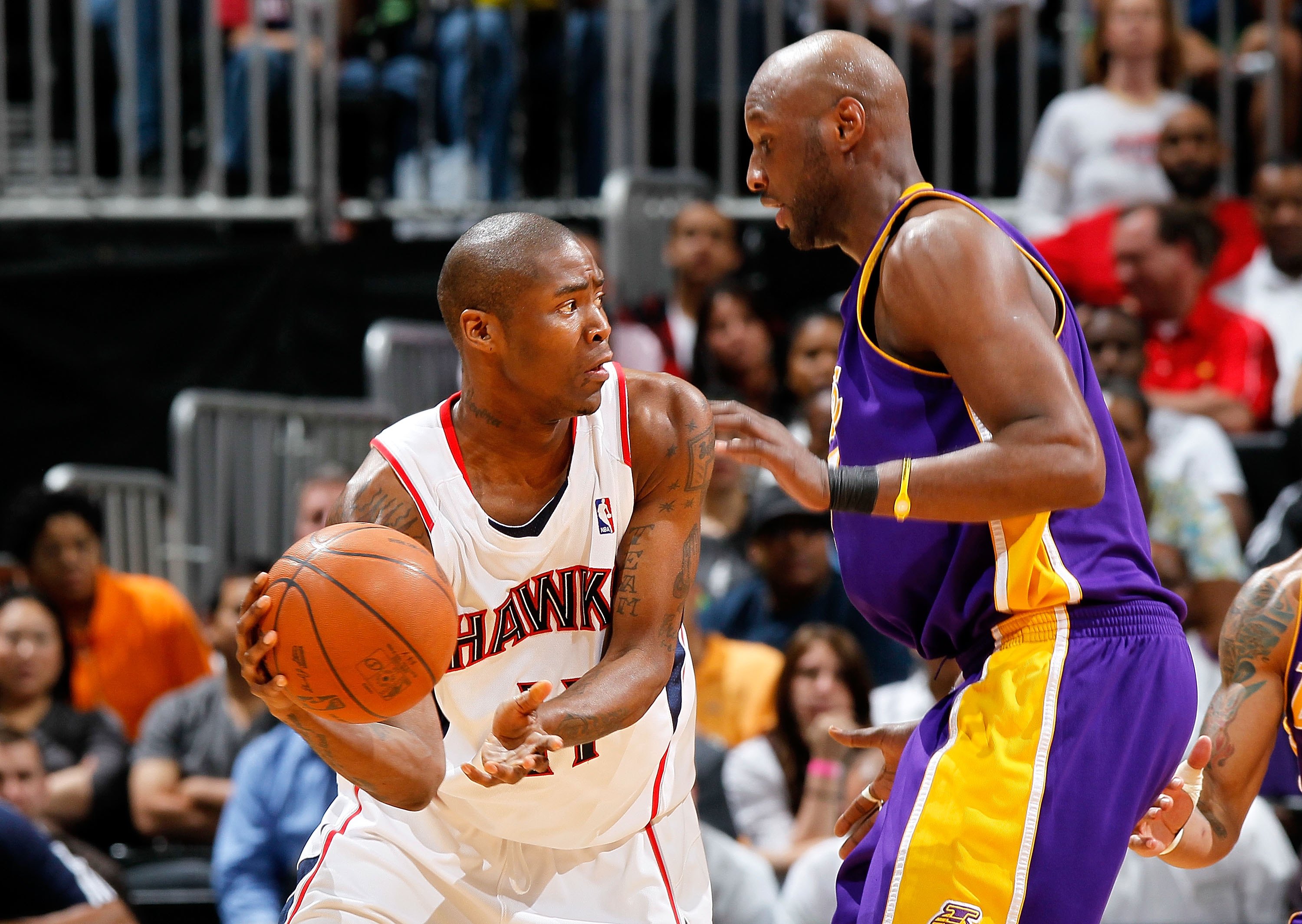 ATLANTA - MARCH 31:  Jamal Crawford #11 of the Atlanta Hawks against Lamar Odom #7 of the Los Angeles Lakers at Philips Arena on March 31, 2010 in Atlanta, Georgia.  NOTE TO USER: User expressly acknowledges and agrees that, by downloading and/or using th
