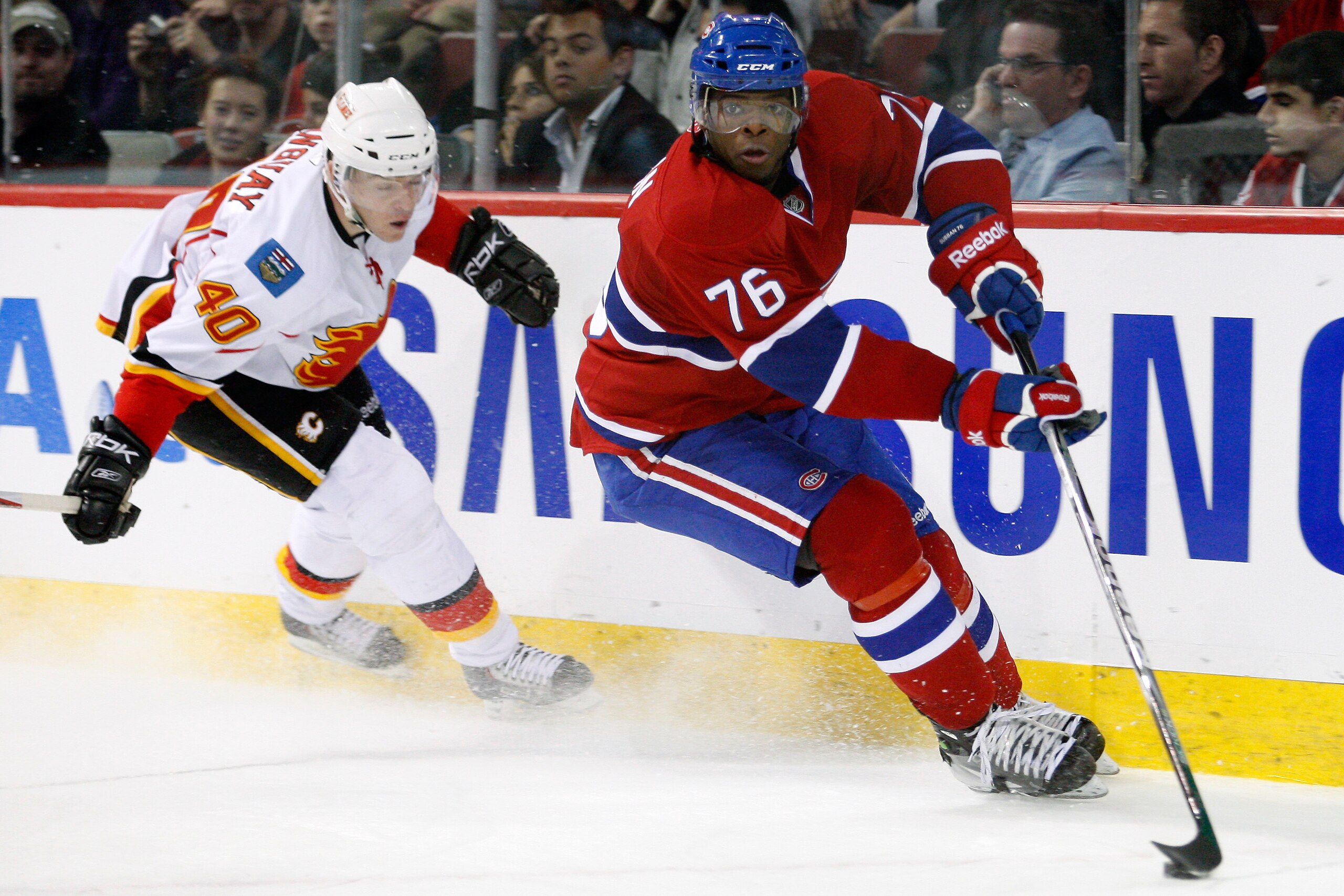 MONTREAL, CANADA - JANUARY 17:  P.K. Subban #76 of the Montreal Canadiens skates with the puck while being chased by Alex Tanguay #40 of the Calgary Flames during the NHL game at the Bell Centre on January 17, 2011 in Montreal, Quebec, Canada.  The Canadi