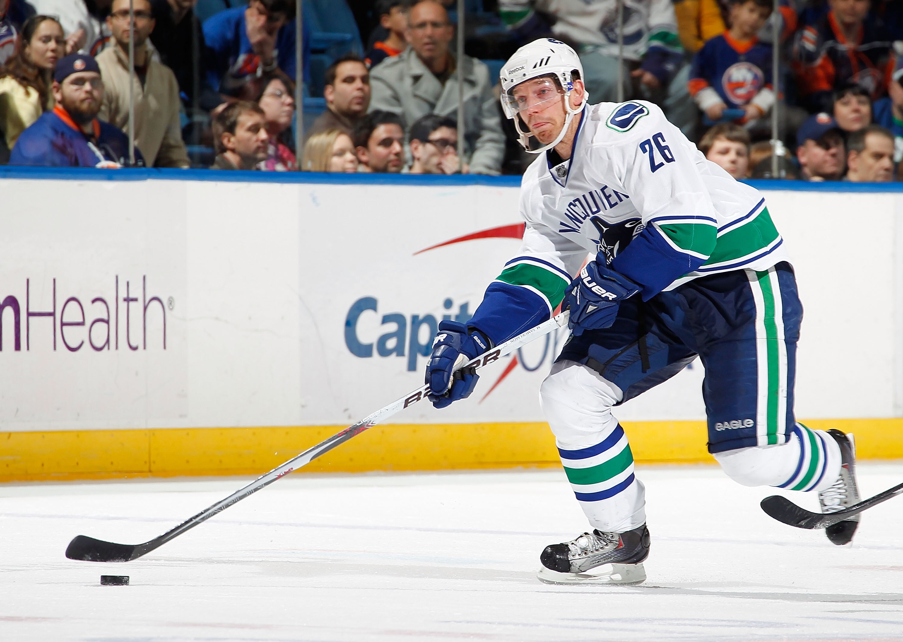 UNIONDALE, NY - JANUARY 11:  Mikael Samuelsson #26 of the Vancouver Canucks skates during an NHL game against the New York Islanders at Nassau Coliseum on January 11, 2011 in Uniondale, New York.  (Photo by Paul Bereswill/Getty Images)