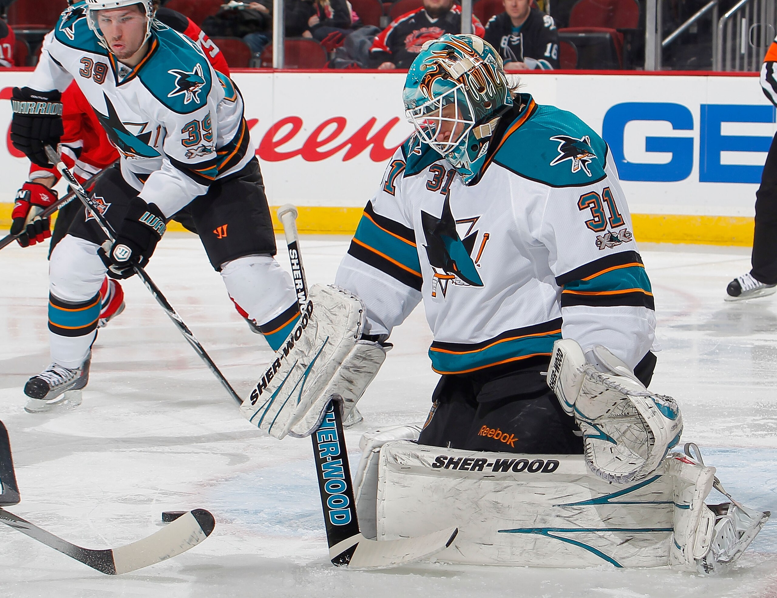 NEWARK, NJ - FEBRUARY 11:  Goalie Antti Niemi #31 of the San Jose Sharks stops a shot by the New Jersey Devils during the second period of an NHL hockey game on February 11, 2011 at the Prudential Center in Newark, New Jersey.  (Photo by Paul Bereswill/Ge