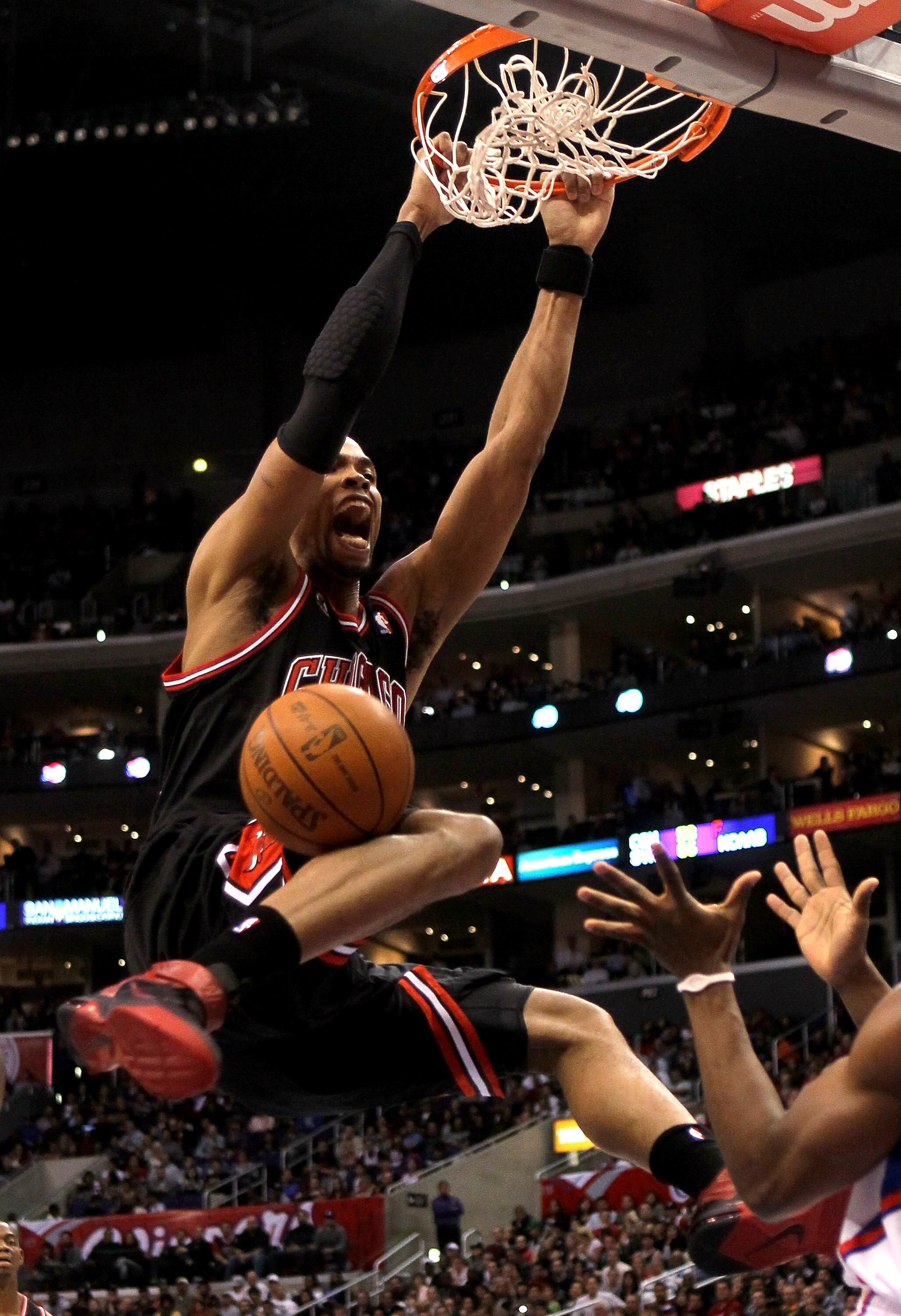 LOS ANGELES, CA - FEBRUARY 02:  Taj Gibson #22 of the Chicago Bulls dunks against the Los Angeles Clippers at Staples Center on February 2, 2011  in Los Angeles, California.  NOTE TO USER: User expressly acknowledges and agrees that, by downloading and or