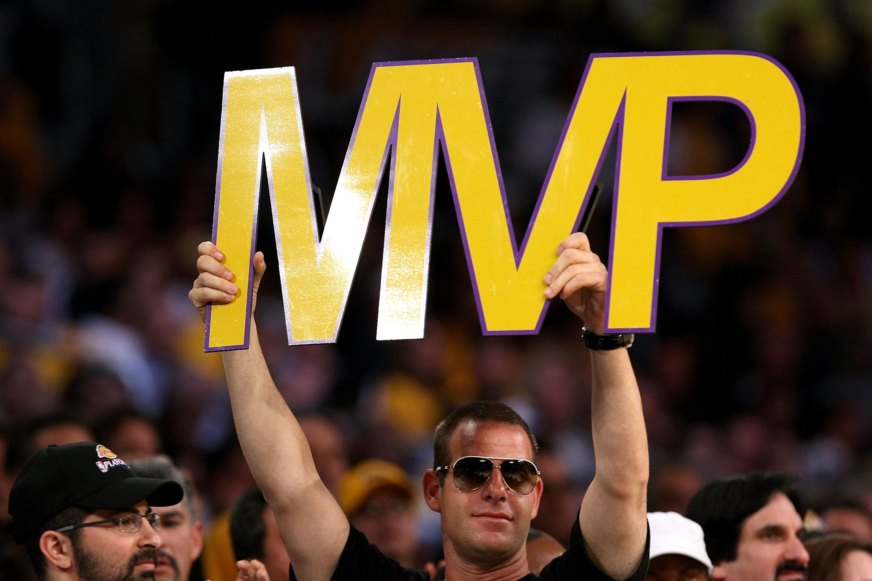 LOS ANGELES, CA - MAY 07:  A fan holds up an MVP sign as Kobe Bryant #24 of the Los Angeles Lakers is awarded the MVP trophy during the Lakers' win over the Utah Jazz in Game Two of the Western Conference Semifinals during the 2008 NBA Playoffs on May 7,