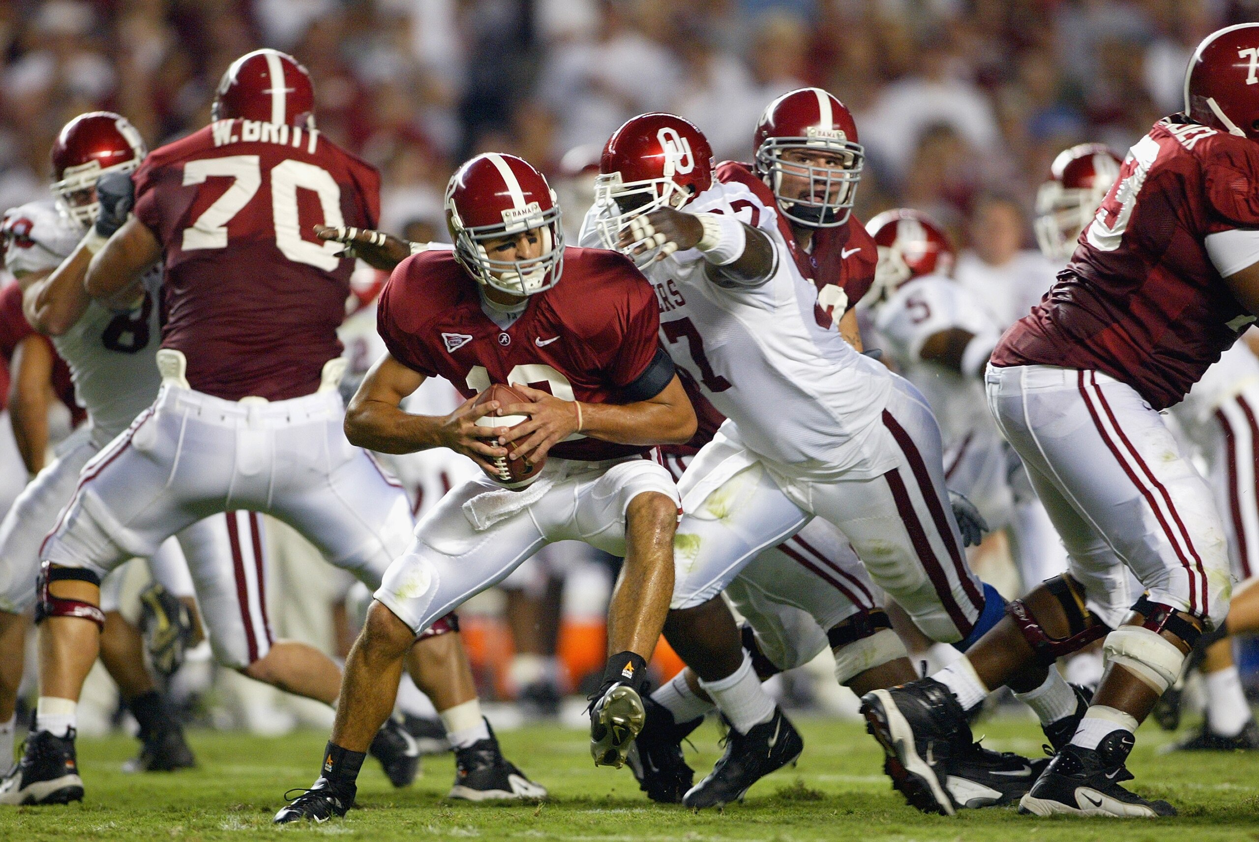 TUSCALOOSA, AL - SEPTEMBER 6: Quarterback Brodie Croyle #12 of the Alabama Crimson Tide is sacked by Tommie Harris #97 of the Oklahoma Sooners on September 6, 2003 in Tuscaloosa, Alabama. Oklahoma defeated Alabama 20-13. (Photo by Jamie Squire/Getty Image