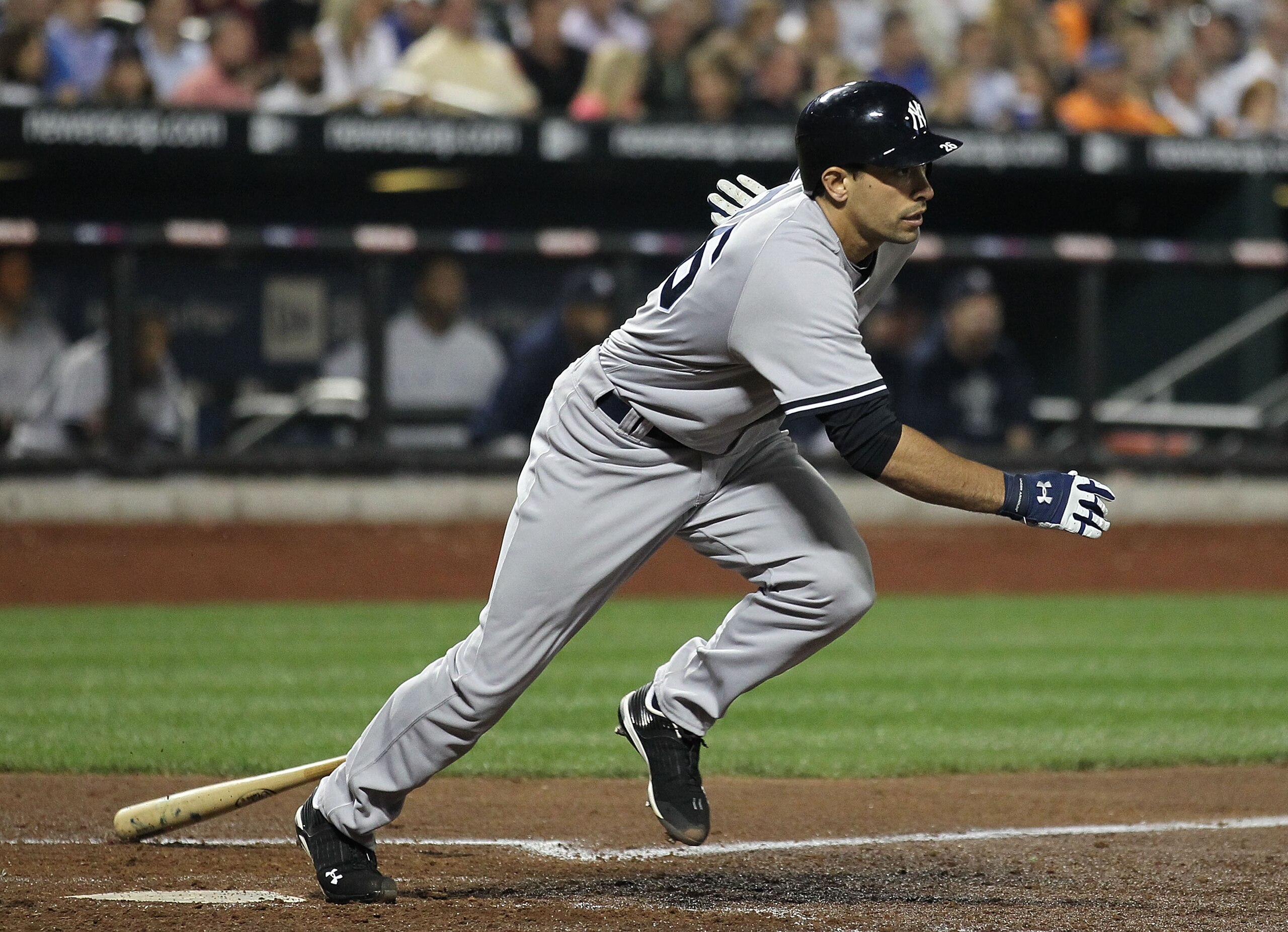 NEW YORK - MAY 21: Kevin Russo #26 of the New York Yankees hits a double and drives in two runs against  the New York Mets on May 21, 2010 at Citi Field in the Flushing neighborhood of the Queens borough of New York City.  (Photo by Al Bello/Getty Images)