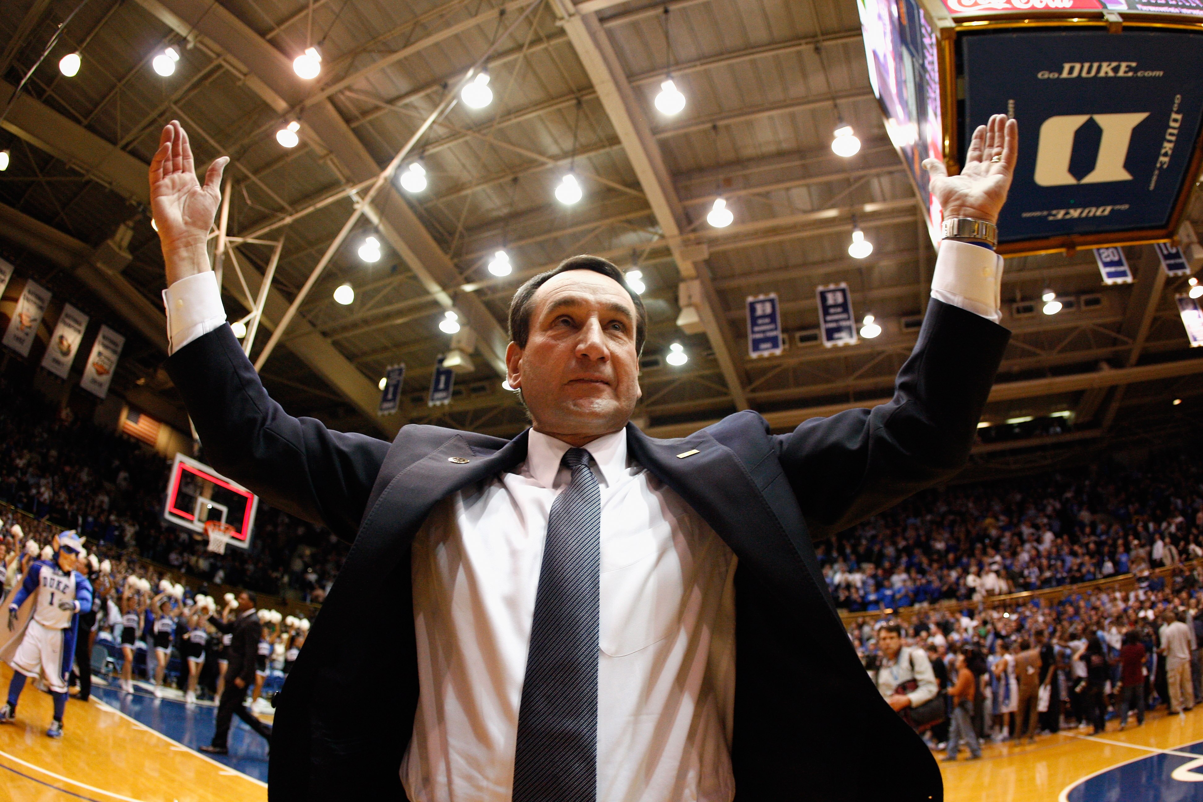 DURHAM, NC - FEBRUARY 09:  Head coach Mike Krzyzewski of the Duke Blue Devils celebrates with fans after defeating the North Carolina Tar Heels 79-73 at Cameron Indoor Stadium on February 9, 2011 in Durham, North Carolina.  (Photo by Streeter Lecka/Getty