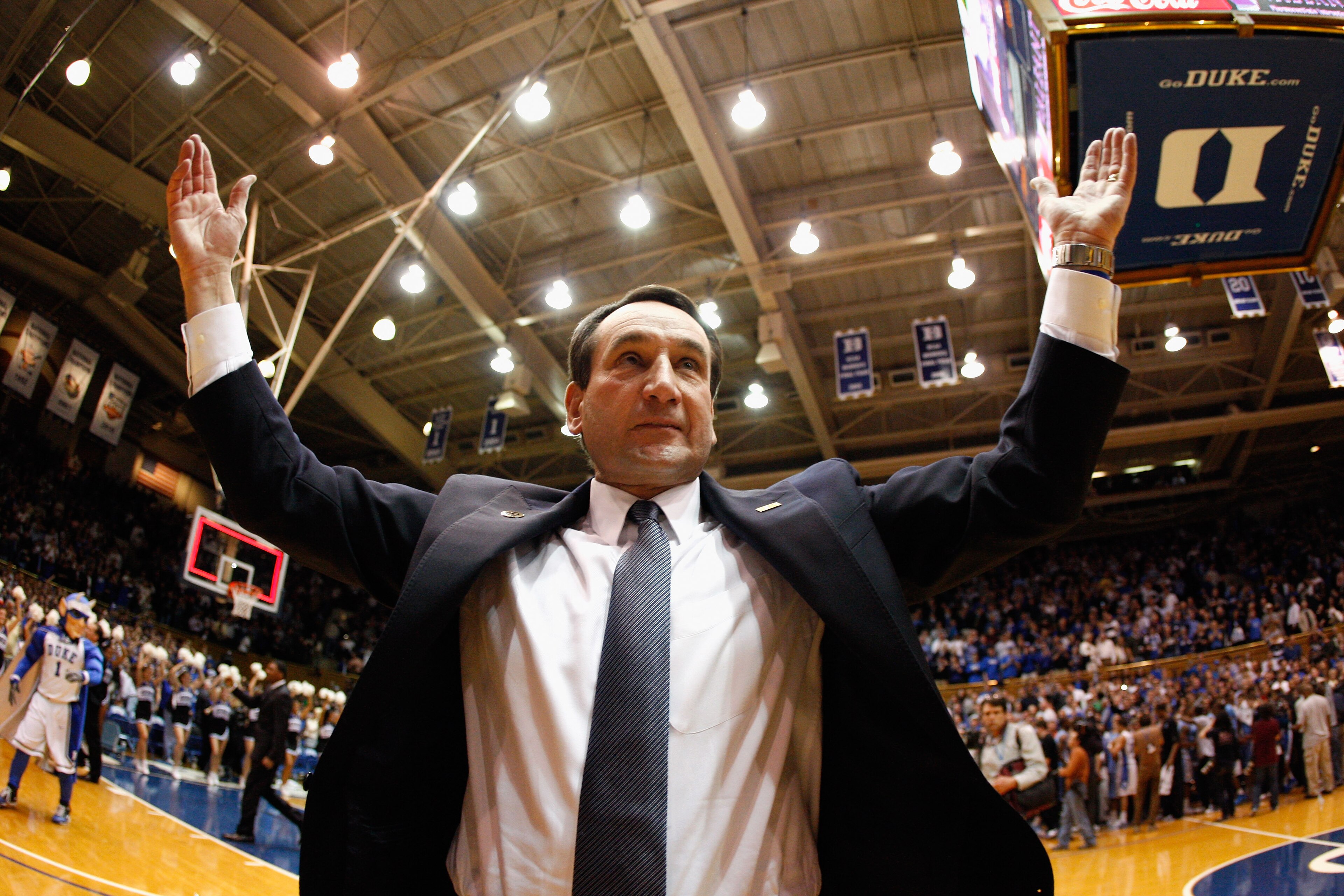 DURHAM, NC - FEBRUARY 09:  Head coach Mike Krzyzewski of the Duke Blue Devils celebrates with fans after defeating the North Carolina Tar Heels 79-73 at Cameron Indoor Stadium on February 9, 2011 in Durham, North Carolina.  (Photo by Streeter Lecka/Getty