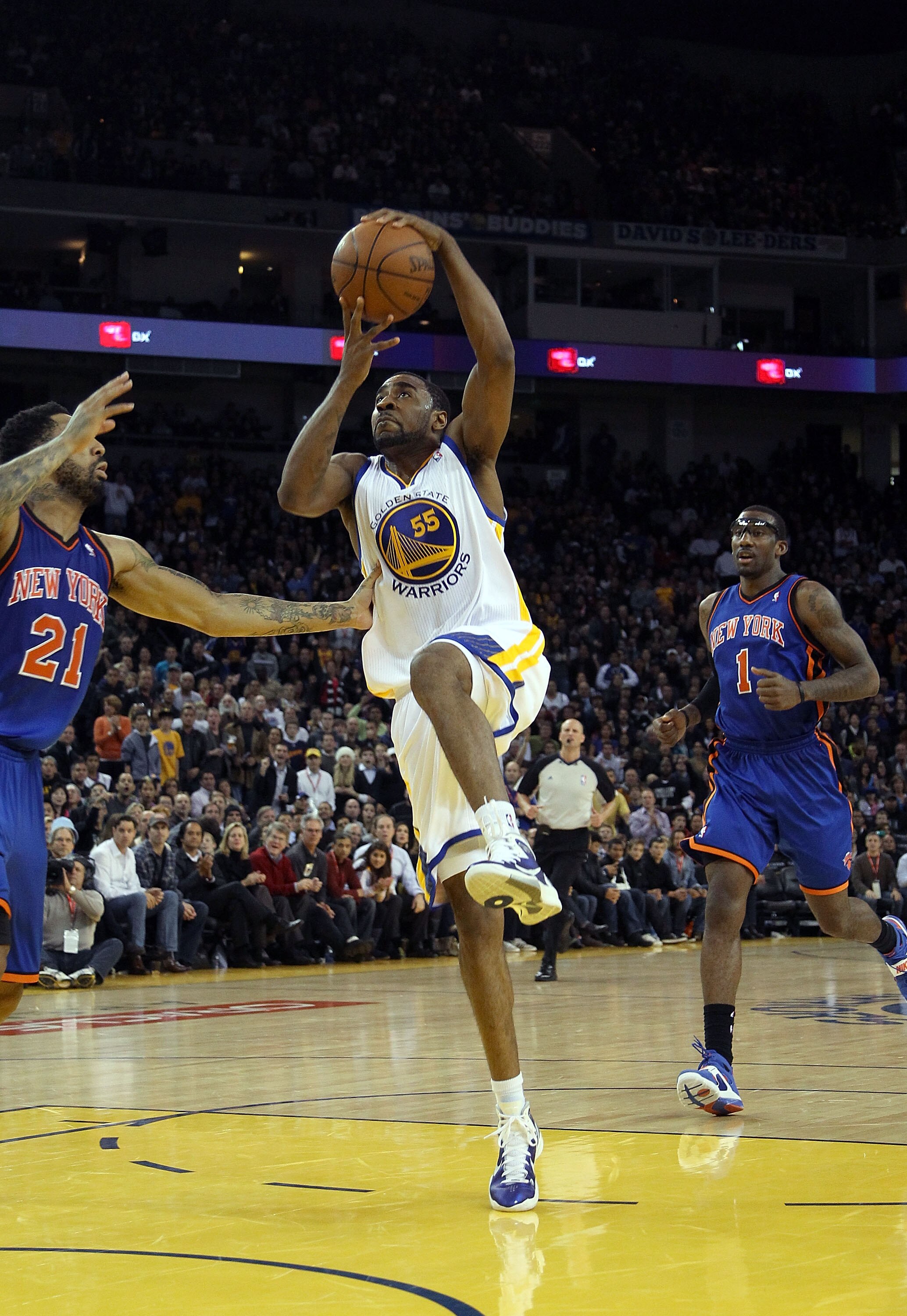 OAKLAND, CA - NOVEMBER 19:  Reggie Williams #55  of the Golden State Warriors in action against the New York Knicks at Oracle Arena on November 19, 2010 in Oakland, California. NOTE TO USER: User expressly acknowledges and agrees that, by downloading and