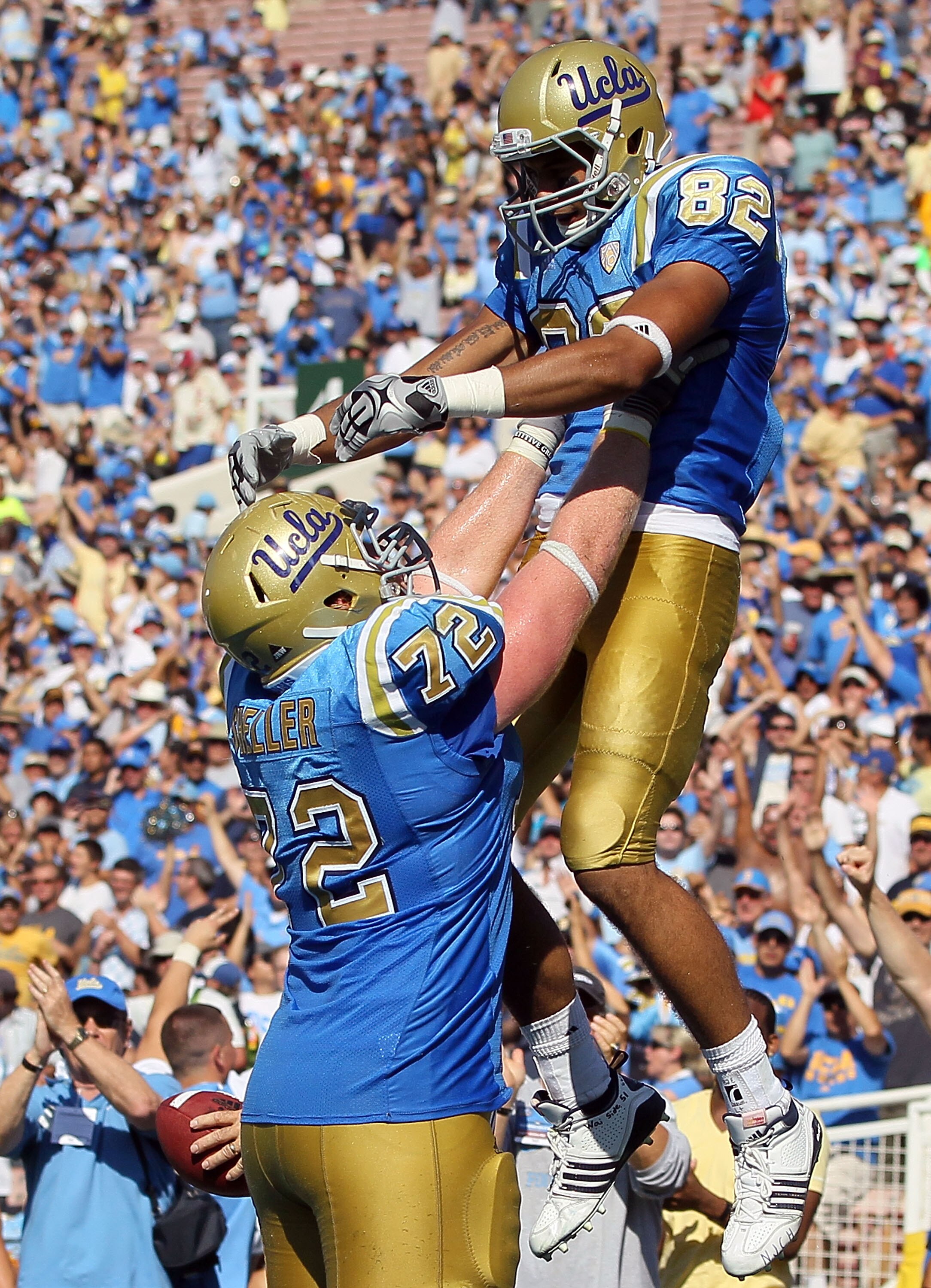 PASADENA, CA - OCTOBER 02:  Taylor Embree #82 and Sean Sheller #72 of the UCLA Bruins celebrate a touchdown against the Washington State Cougars during the game at the Rose Bowl on October 2, 2010 in Pasadena, California. UCLA defeated Washington State 42