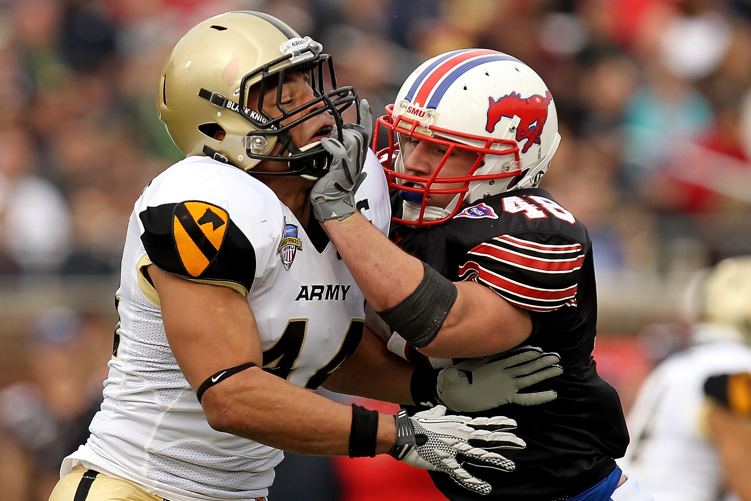 DALLAS, TX - DECEMBER 30: Defensive end Joshua McNary #44 of the Army Black Knights defends the play against Zach Line #48 of the SMU Mustangs during the Bell Helicopter Armed Forces Bowl at Gerald J. Ford Stadium on December 30, 2010 in Dallas, Texas. DALLAS, TX - DECEMBER 30: Defensive end Joshua McNary #44 of the Army Black Knights defends the play against Zach Line #48 of the SMU Mustangs during the Bell Helicopter Armed Forces Bowl at Gerald J. Ford Stadium on December 30, 2010 in Dallas, Texas.