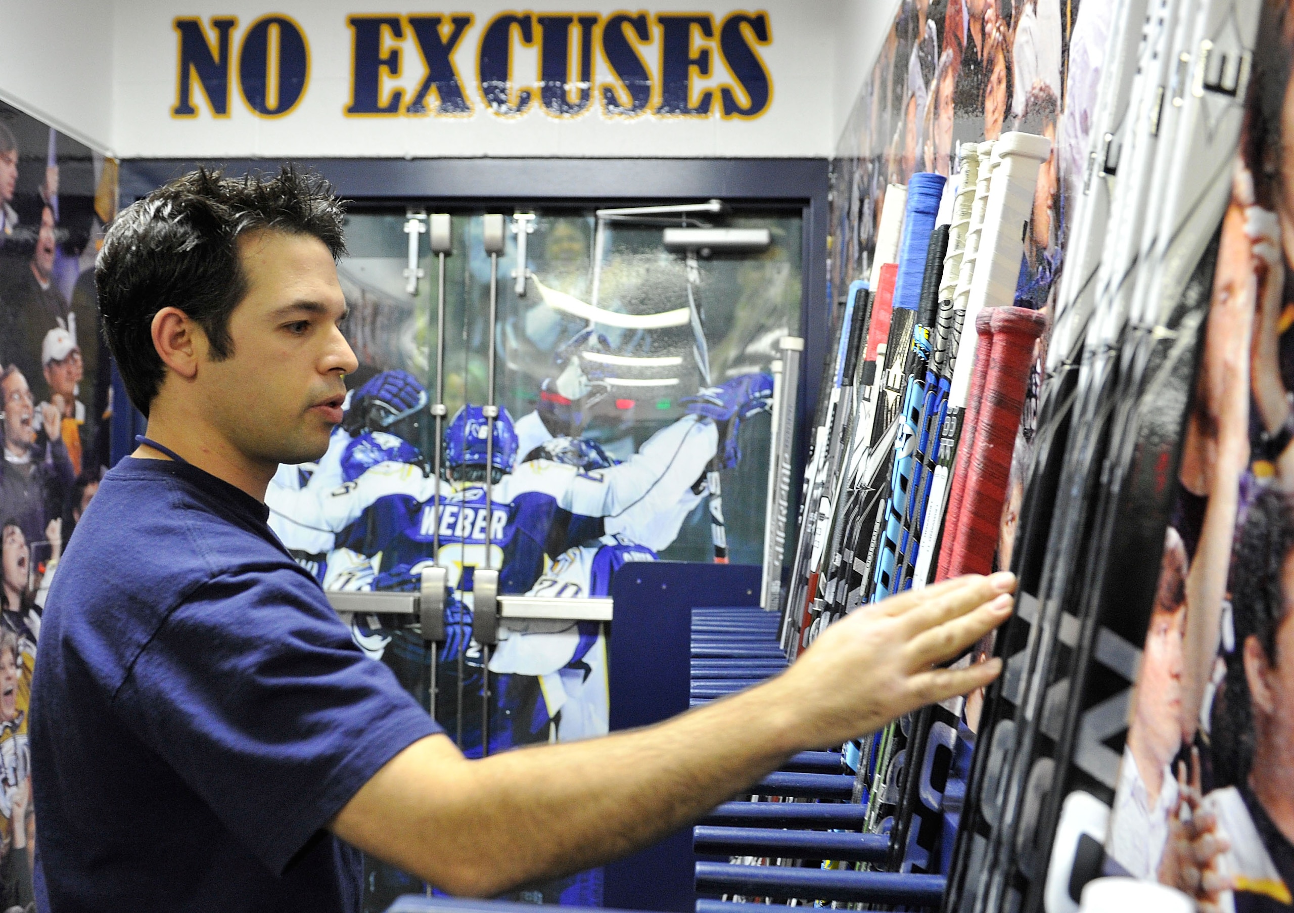 NASHVILLE, TN - OCTOBER 28: Jeff Camelio, assistant equipment manager for the Nashville Predators, prepares sticks prior to a game against the St. Louis Blues on October 28, 2010 at Bridgestone Arena in Nashville, Tennessee. (Photo by Frederick Breedon/ NASHVILLE, TN - OCTOBER 28: Jeff Camelio, assistant equipment manager for the Nashville Predators, prepares sticks prior to a game against the St. Louis Blues on October 28, 2010 at Bridgestone Arena in Nashville, Tennessee. (Photo by Frederick Breedon/