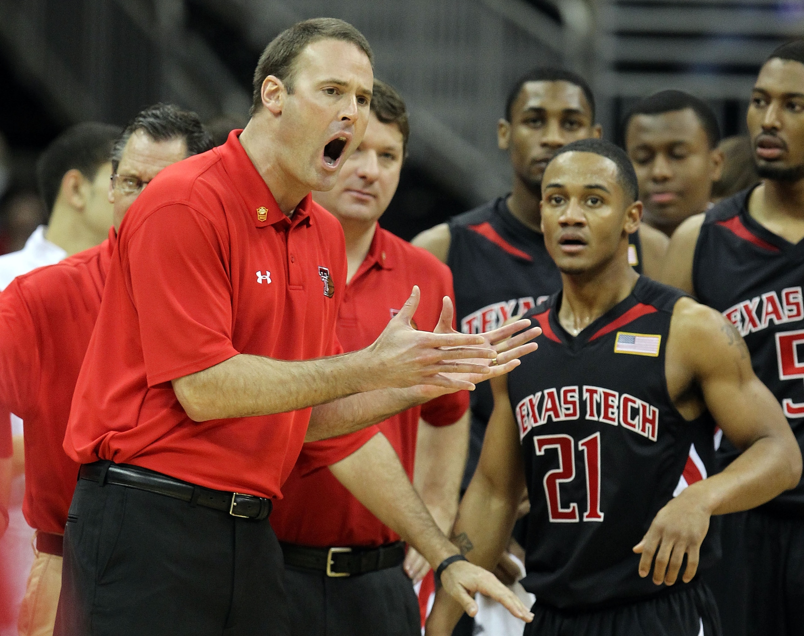 KANSAS CITY, MO - MARCH 11:  Head coach Pat Knight of the Texas Tech Red Raiders yells over at John Roberson #21 in the first half while taking on the Kansas Jayhawks during the quarterfinals of the 2010 Phillips 66 Big 12 Men's Basketball Tournament at t