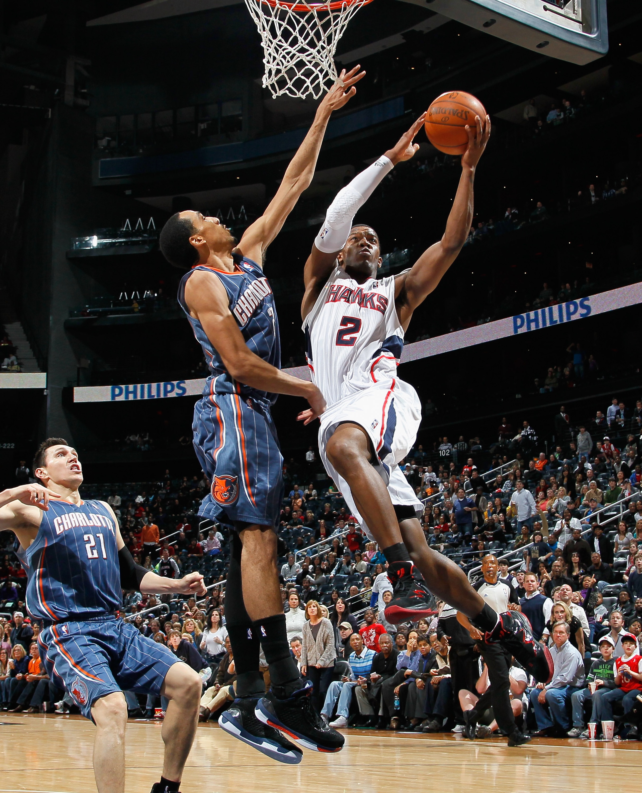 ATLANTA, GA - FEBRUARY 12:  Joe Johnson #2 of the Atlanta Hawks drives against Shaun Livingston #2 of the Charlotte Bobcats at Philips Arena on February 12, 2011 in Atlanta, Georgia.  NOTE TO USER: User expressly acknowledges and agrees that, by downloadi