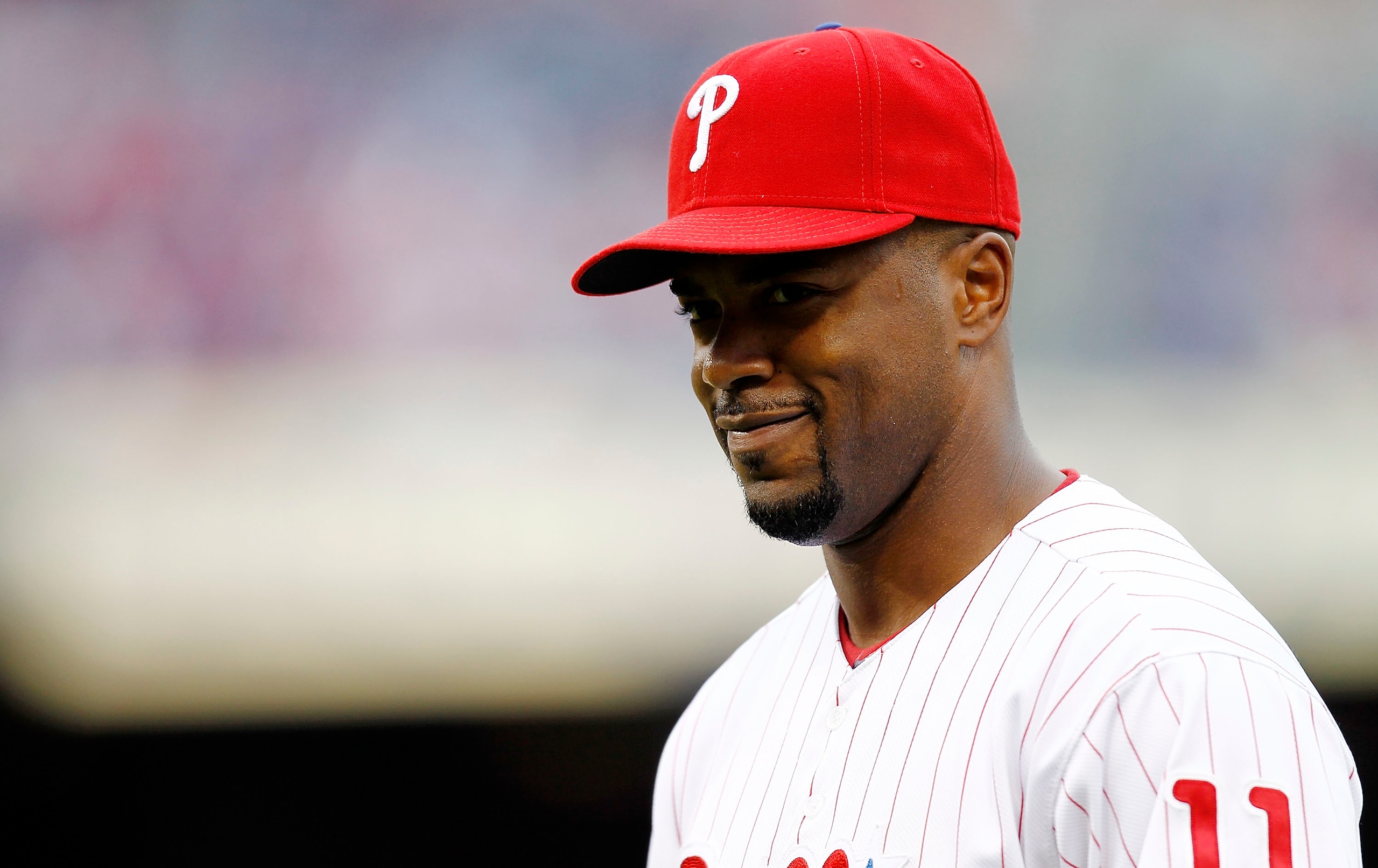 PHILADELPHIA - OCTOBER 06:  Jimmy Rollins #11 of the Philadelphia Phillies warms up before Game 1 of the NLDS against the Cincinnati Reds at Citizens Bank Park on October 6, 2010 in Philadelphia, Pennsylvania.  (Photo by Jeff Zelevansky/Getty Images)