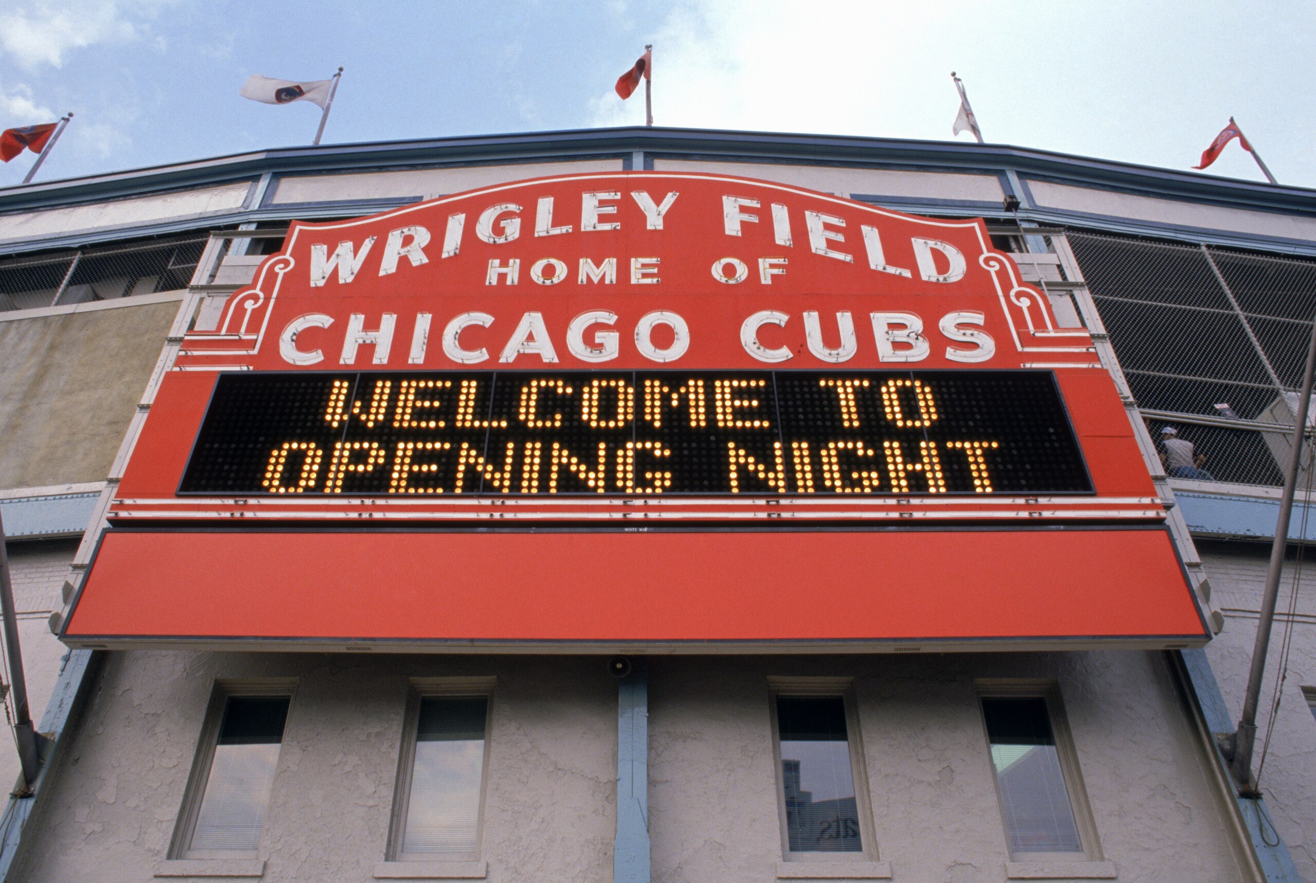 CHICAGO - APRIL 4: Exterior view of Wrigley Field's marquee welcoming fans for the home opening game between the Chicago Cubs and the Philadelphia Phillies at Wrigley Field on April 4, 1989 in Chicago, Illinois. The Cubs won 5-4. (Photo by Jonathan Dan CHICAGO - APRIL 4: Exterior view of Wrigley Field's marquee welcoming fans for the home opening game between the Chicago Cubs and the Philadelphia Phillies at Wrigley Field on April 4, 1989 in Chicago, Illinois. The Cubs won 5-4. (Photo by Jonathan Dan