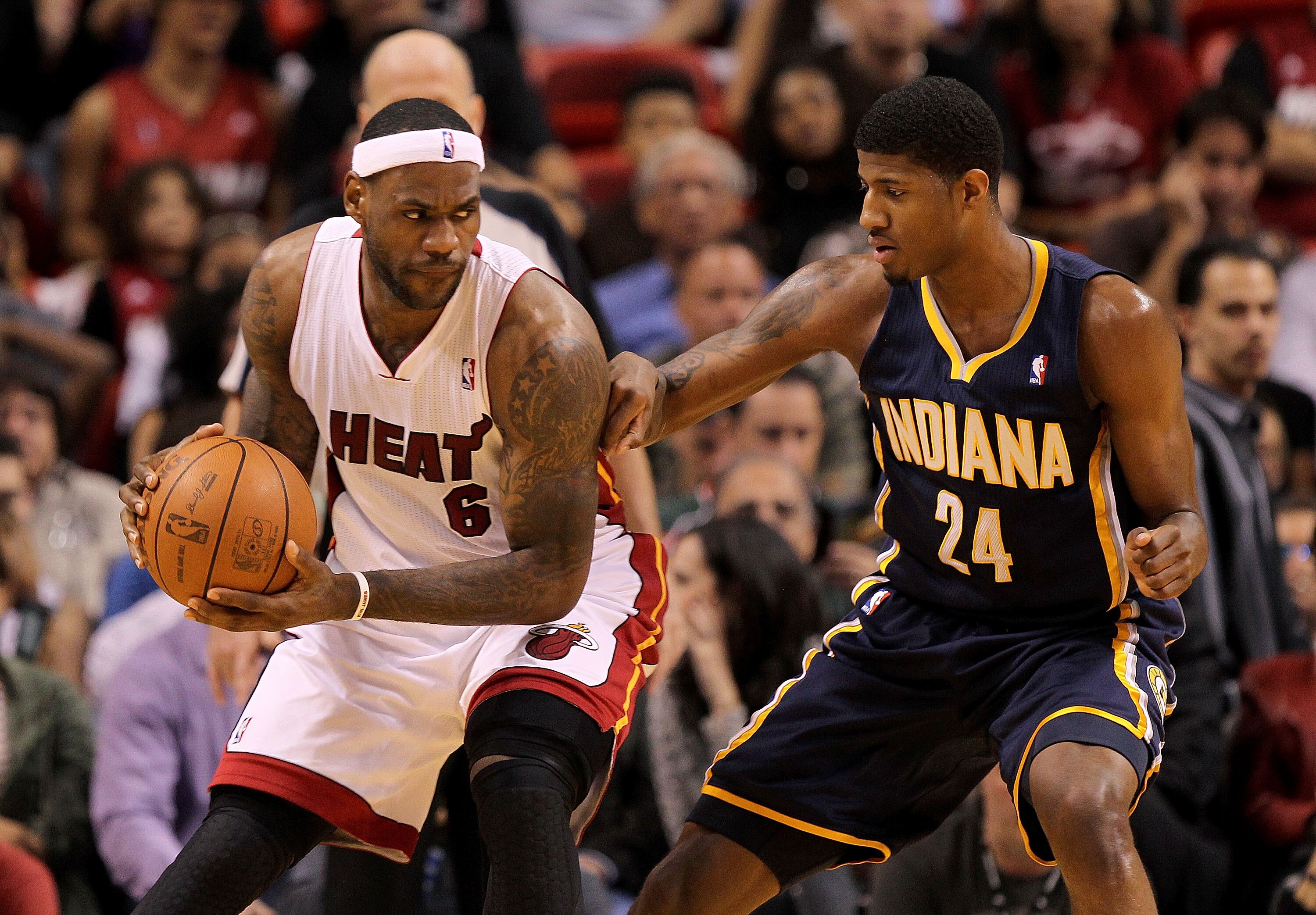 MIAMI, FL - FEBRUARY 08:  LeBron James #6 of the Miami Heat posts up Paul George #24 of the Indiana Pacers during a game at American Airlines Arena on February 8, 2011 in Miami, Florida. NOTE TO USER: User expressly acknowledges and agrees that, by downlo