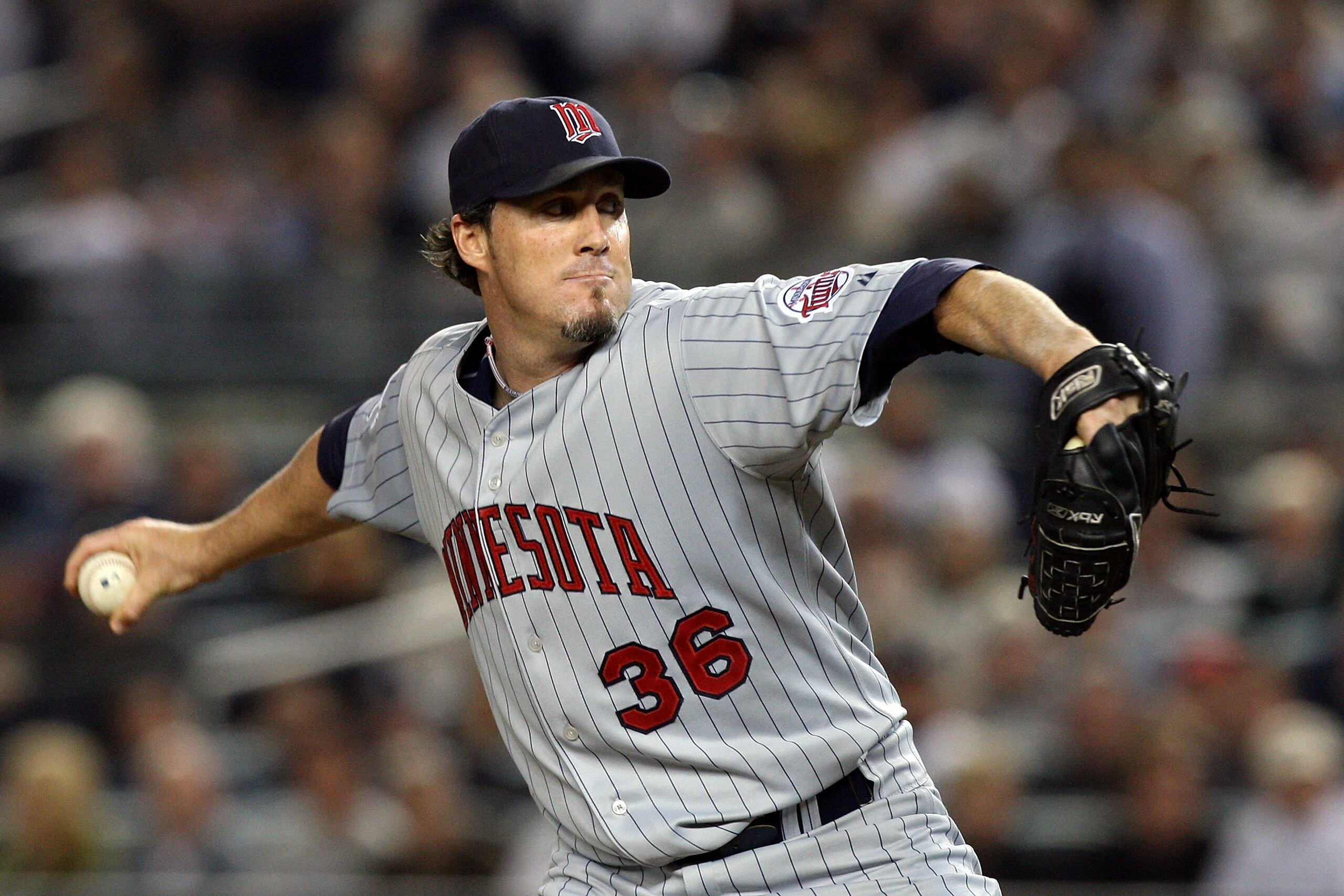 NEW YORK - OCTOBER 09:  Joe Nathan #36 of the Minnesota Twins pitches against the New York Yankees in Game Two of the ALDS during the 2009 MLB Playoffs at Yankee Stadium on October 9, 2009 in the Bronx borough of New York City.  (Photo by Jim McIsaac/Gett