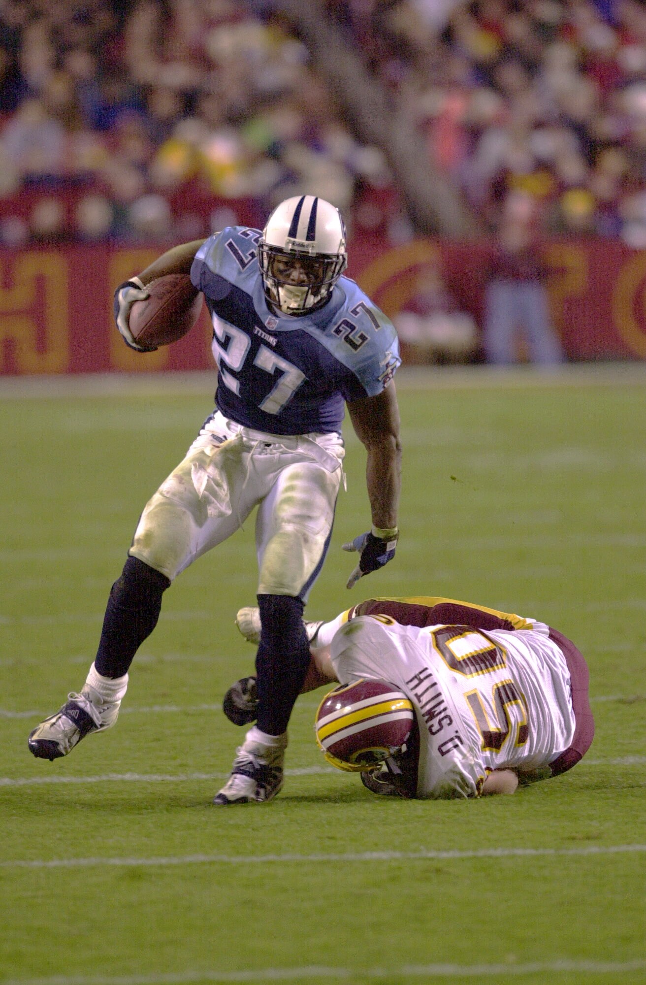 30 Oct 2000:  #27 Eddie George of the Tennessee Titans breaks a tackle by #50 Derek Smith of the Washington Redskins as the Titans defeated the Redskins 27-21 at Fed Ex Field in Landover, Maryland. <<DIGITAL IMAGE>> Mandatory Credit: Doug Pensinger/ALLSPO