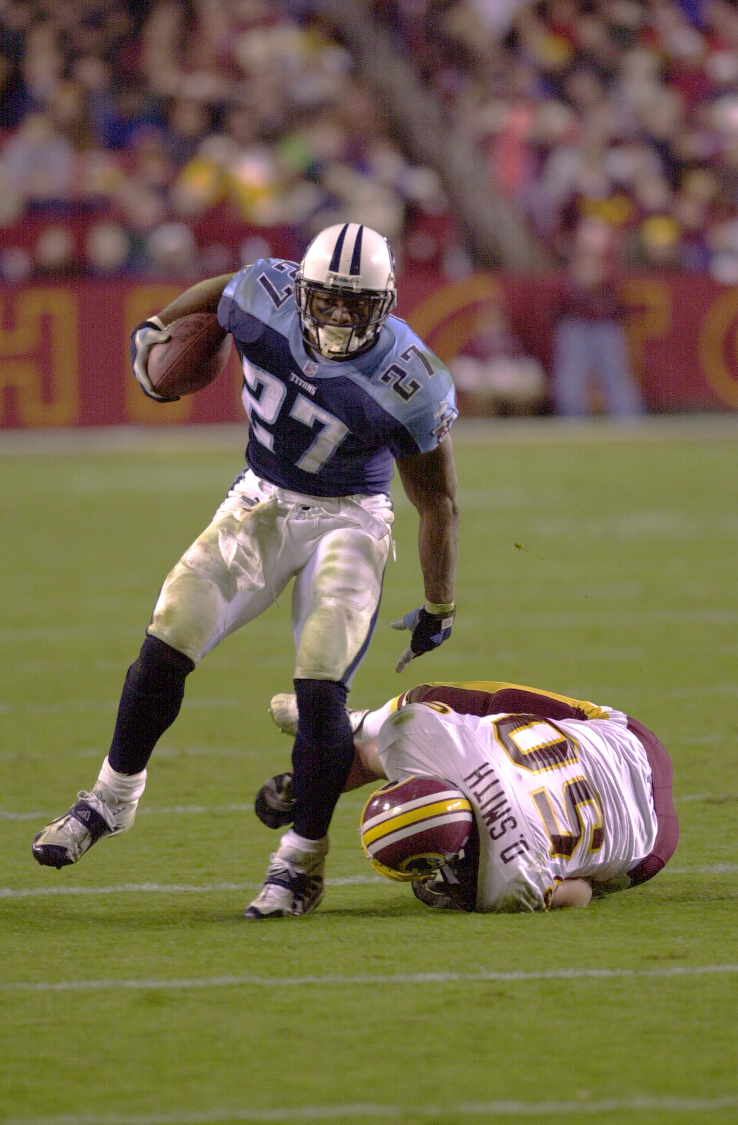 30 Oct 2000: #27 Eddie George of the Tennessee Titans breaks a tackle by #50 Derek Smith of the Washington Redskins as the Titans defeated the Redskins 27-21 at Fed Ex Field in Landover, Maryland. <<DIGITAL IMAGE>> Mandatory Credit: Doug Pensinger/ALLSPO 30 Oct 2000: #27 Eddie George of the Tennessee Titans breaks a tackle by #50 Derek Smith of the Washington Redskins as the Titans defeated the Redskins 27-21 at Fed Ex Field in Landover, Maryland. <<DIGITAL IMAGE>> Mandatory Credit: Doug Pensinger/ALLSPO