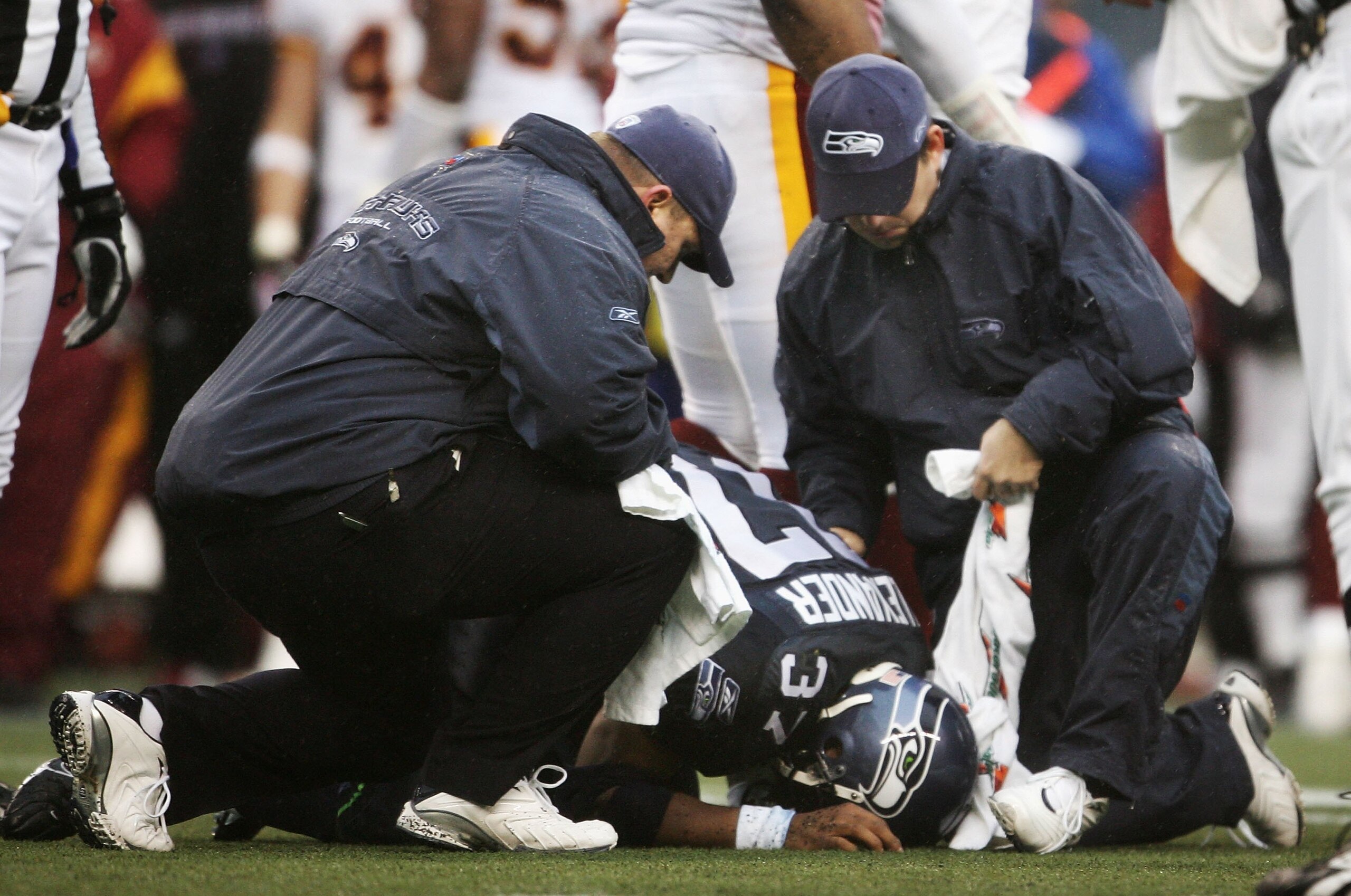 SEATTLE - JANUARY 14: Runningback Shaun Alexander #37 of the Seattle Seahawks is attended to by Seahawks personal after an injury during the first quarter of the NFC Divisional Playoff game on January 14, 2006 at Qwest Field in Seattle, Washington. (Pho SEATTLE - JANUARY 14: Runningback Shaun Alexander #37 of the Seattle Seahawks is attended to by Seahawks personal after an injury during the first quarter of the NFC Divisional Playoff game on January 14, 2006 at Qwest Field in Seattle, Washington. (Pho