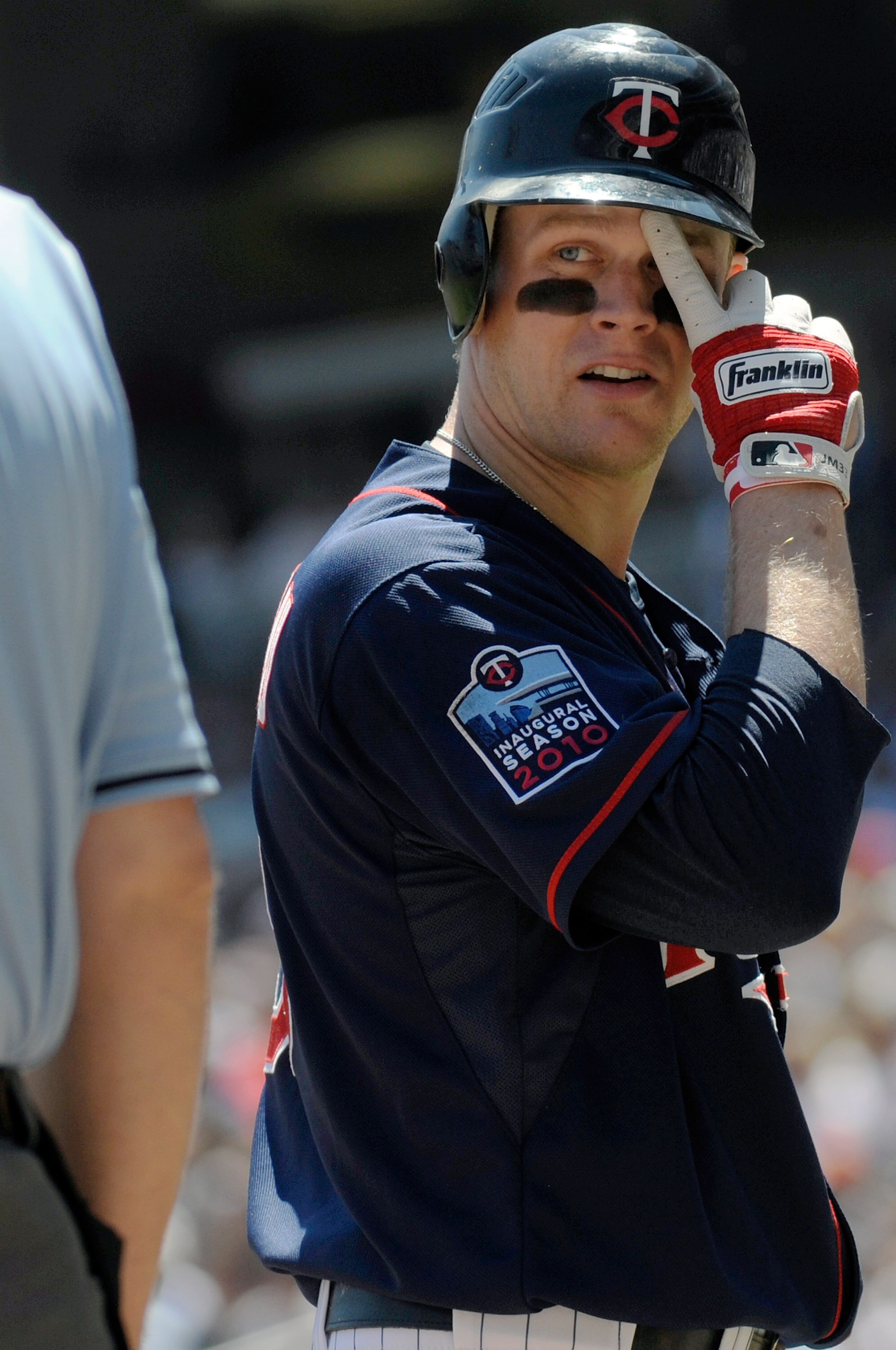 MINNEAPOLIS, MN - JUNE 30: Justin Morneau #33 of the Minnesota Twins looks at home plate umpire Bill Welke #52 after being called out on strikes in the second inning against the Detroit Tigers during their game on June 30, 2010 at Target Field in Minneapo