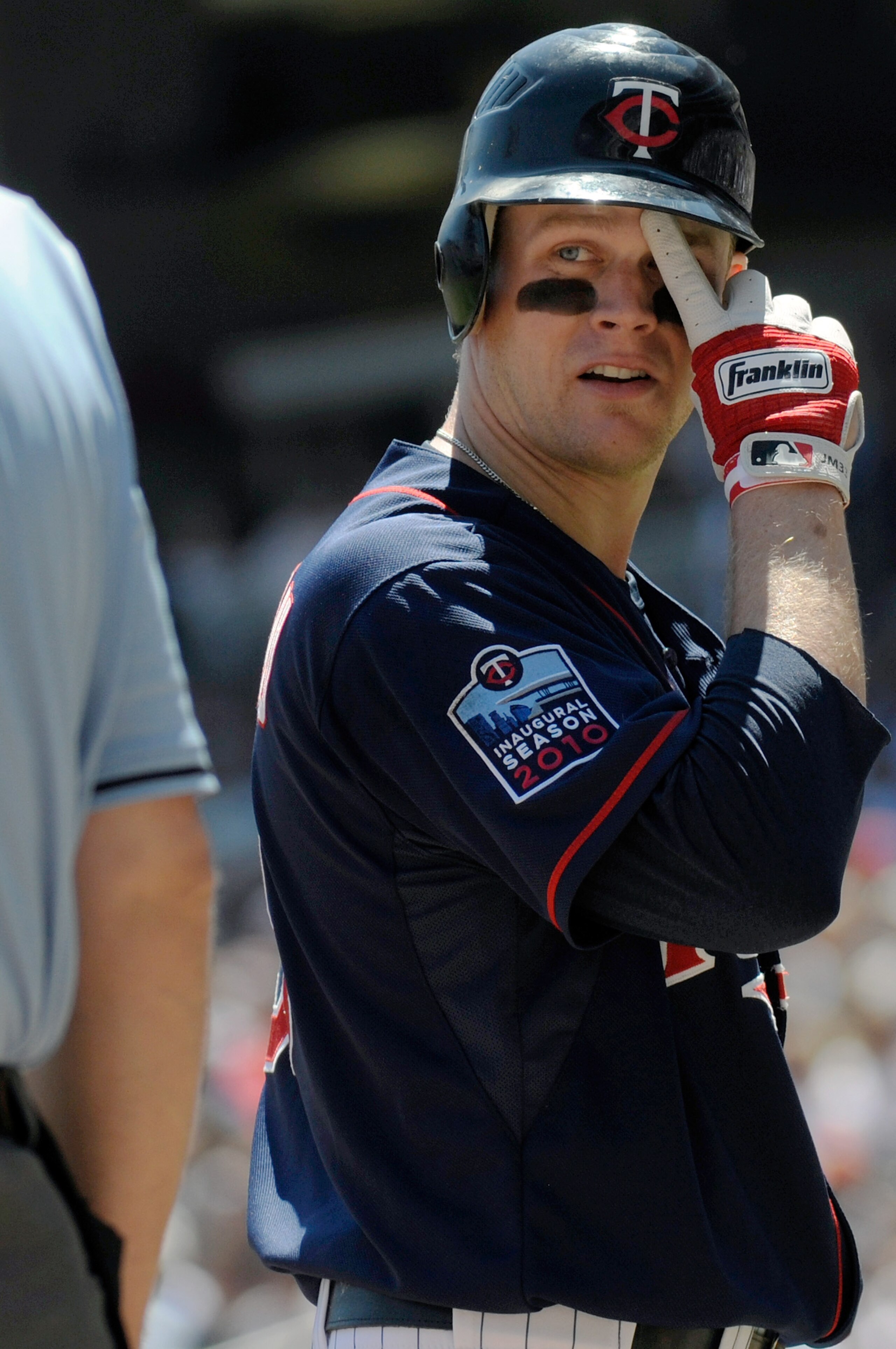 MINNEAPOLIS, MN - JUNE 30: Justin Morneau #33 of the Minnesota Twins looks at home plate umpire Bill Welke #52 after being called out on strikes in the second inning against the Detroit Tigers during their game on June 30, 2010 at Target Field in Minneapo