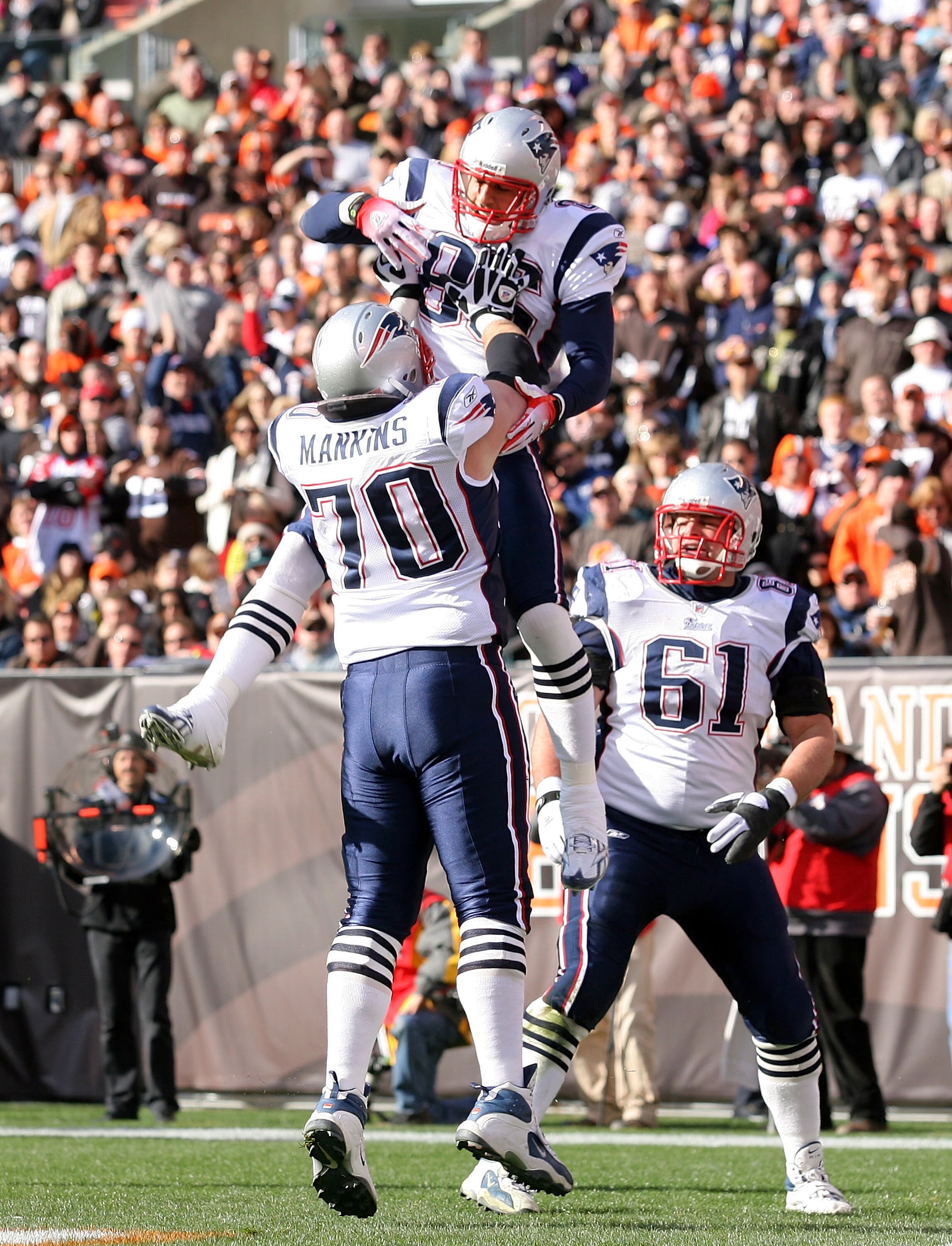 CLEVELAND - NOVEMBER 07:  Tight end Aaron Hernandez #85 of the New England Patriots celebrates with Logan Mankins #70 and Stephen Neal #61 after scoring a touchdown against the Cleveland Browns at Cleveland Browns Stadium on November 7, 2010 in Cleveland,