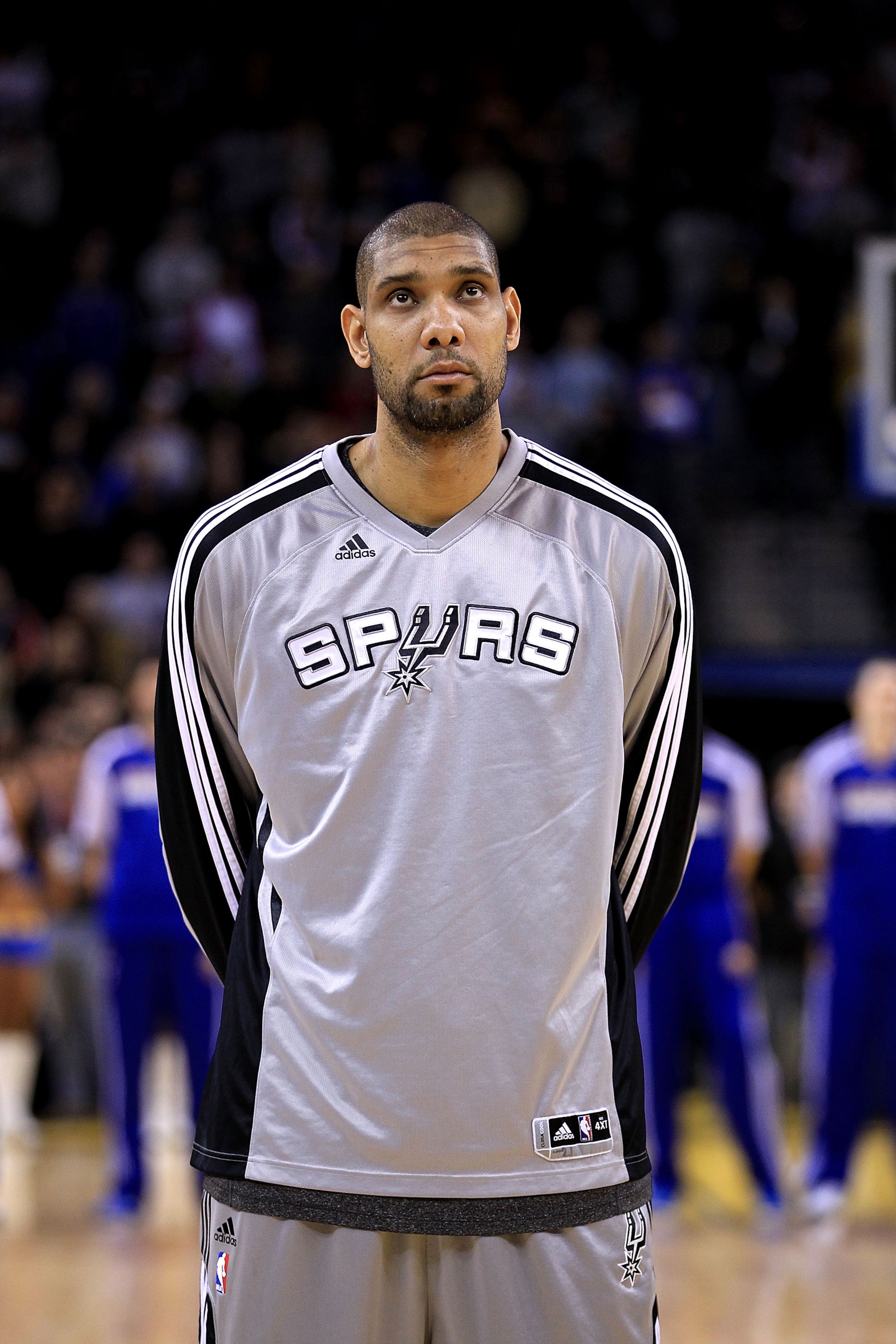 OAKLAND, CA - JANUARY 24: Tim Duncan #21 of the San Antonio Spurs stands for the National Anthem before their game against the Golden State Warriors at Oracle Arena on January 24, 2011 in Oakland, California. NOTE TO USER: User expressly acknowledges an OAKLAND, CA - JANUARY 24: Tim Duncan #21 of the San Antonio Spurs stands for the National Anthem before their game against the Golden State Warriors at Oracle Arena on January 24, 2011 in Oakland, California. NOTE TO USER: User expressly acknowledges an