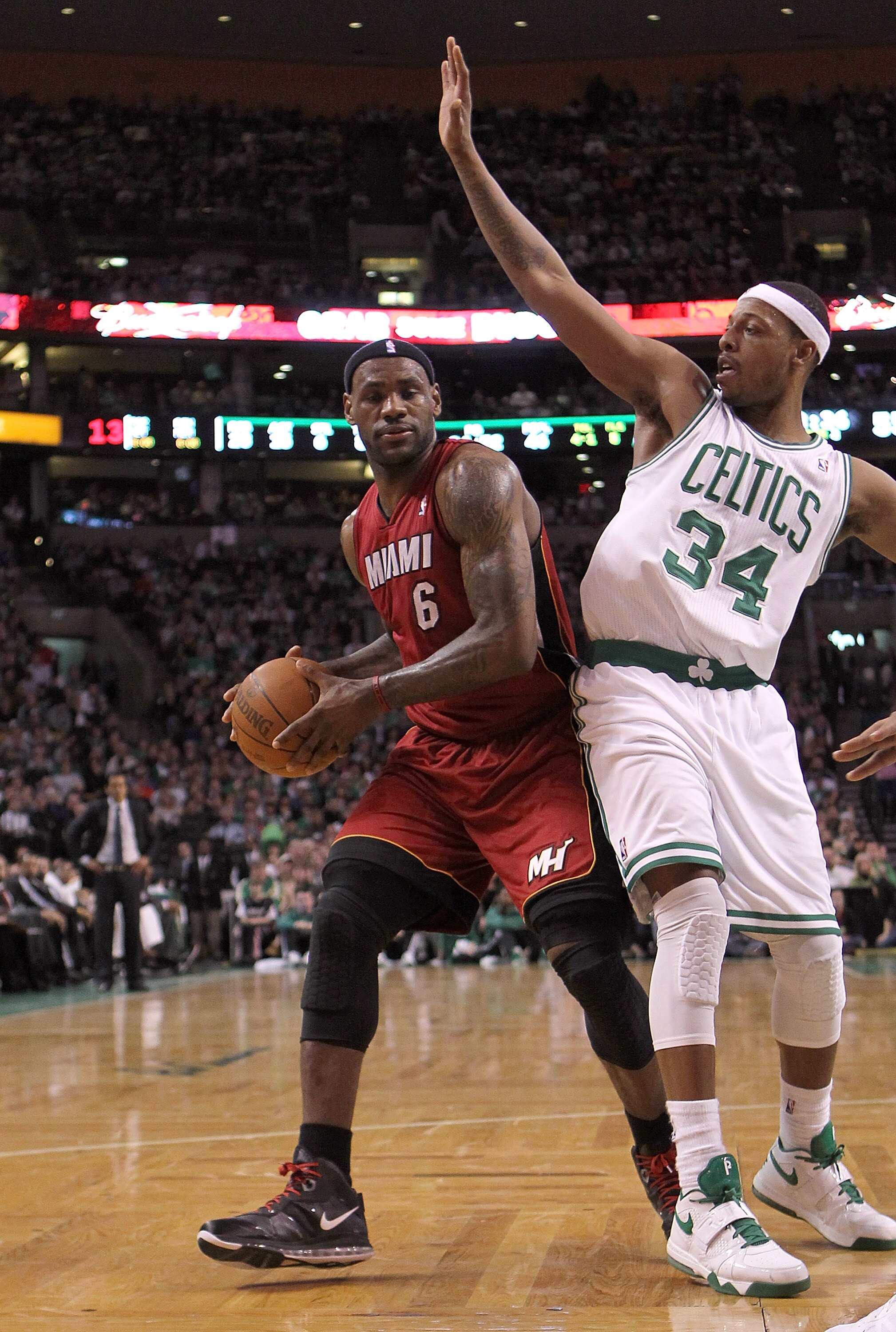 BOSTON - FEBRUARY 13:  LeBron James #6 of the Miami Heat drives  against Paul Pierce #34 of the Boston Celtics at TD Garden on February 13, 2011 in Boston, Massachusetts. NOTE TO USER: User expressly acknowledges and agrees that, by downloading and/or usi