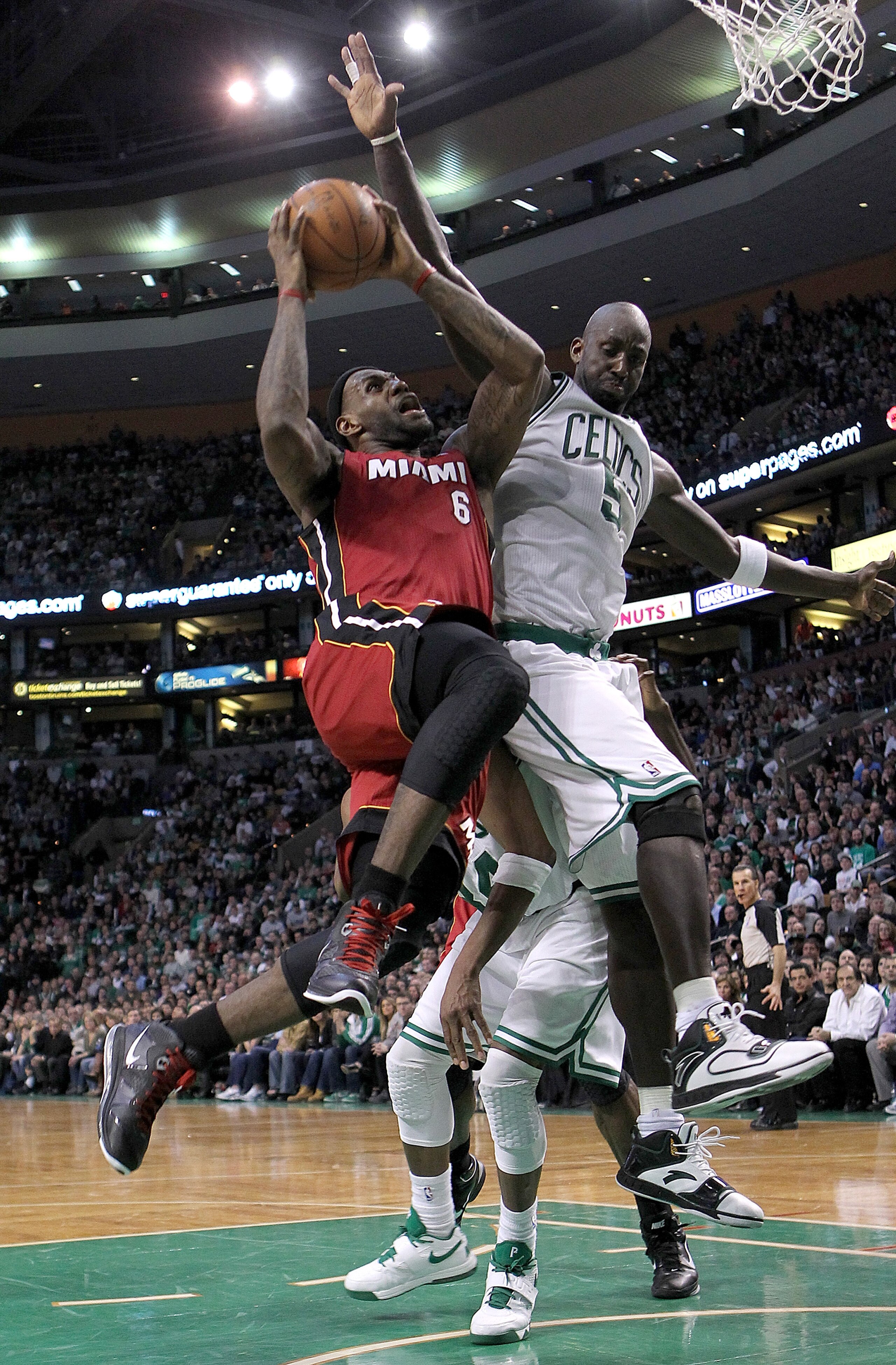 BOSTON - FEBRUARY 13:  LeBron James #6 of the Miami Heat drives  against Kevin Garnett #5 of the Boston Celtics at TD Garden on February 13, 2011 in Boston, Massachusetts. NOTE TO USER: User expressly acknowledges and agrees that, by downloading and/or us