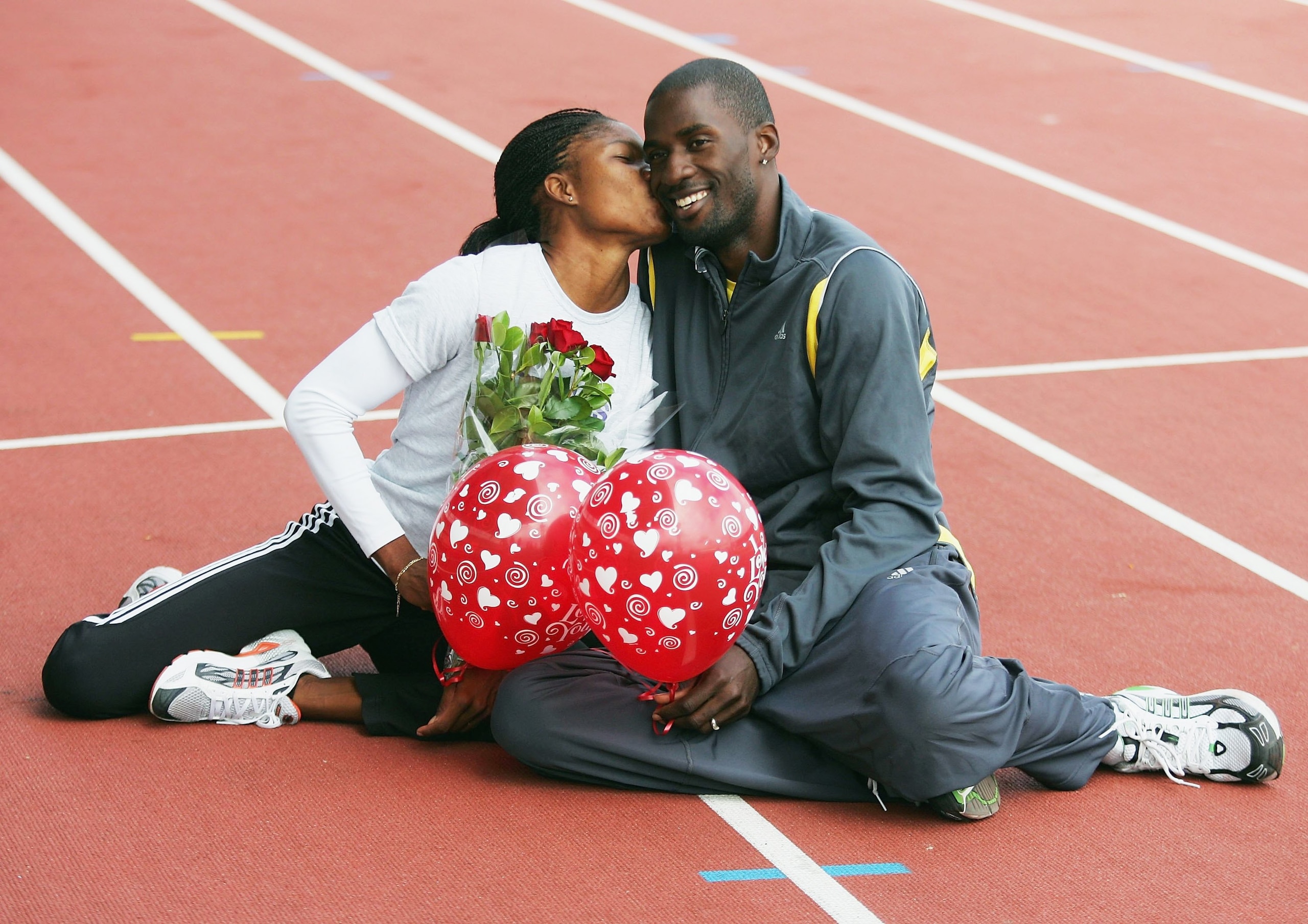 MELBOURNE, AUSTRALIA - FEBRUARY 14:  Caribbean athletes and husband and wife, Cydonie Mothersill (L) and Ato Modibo, pose for a Valentines day photo during a training session February 14, 2006 in Melbourne, Australia. (Photo by Sean Garnsworthy/Getty Imag