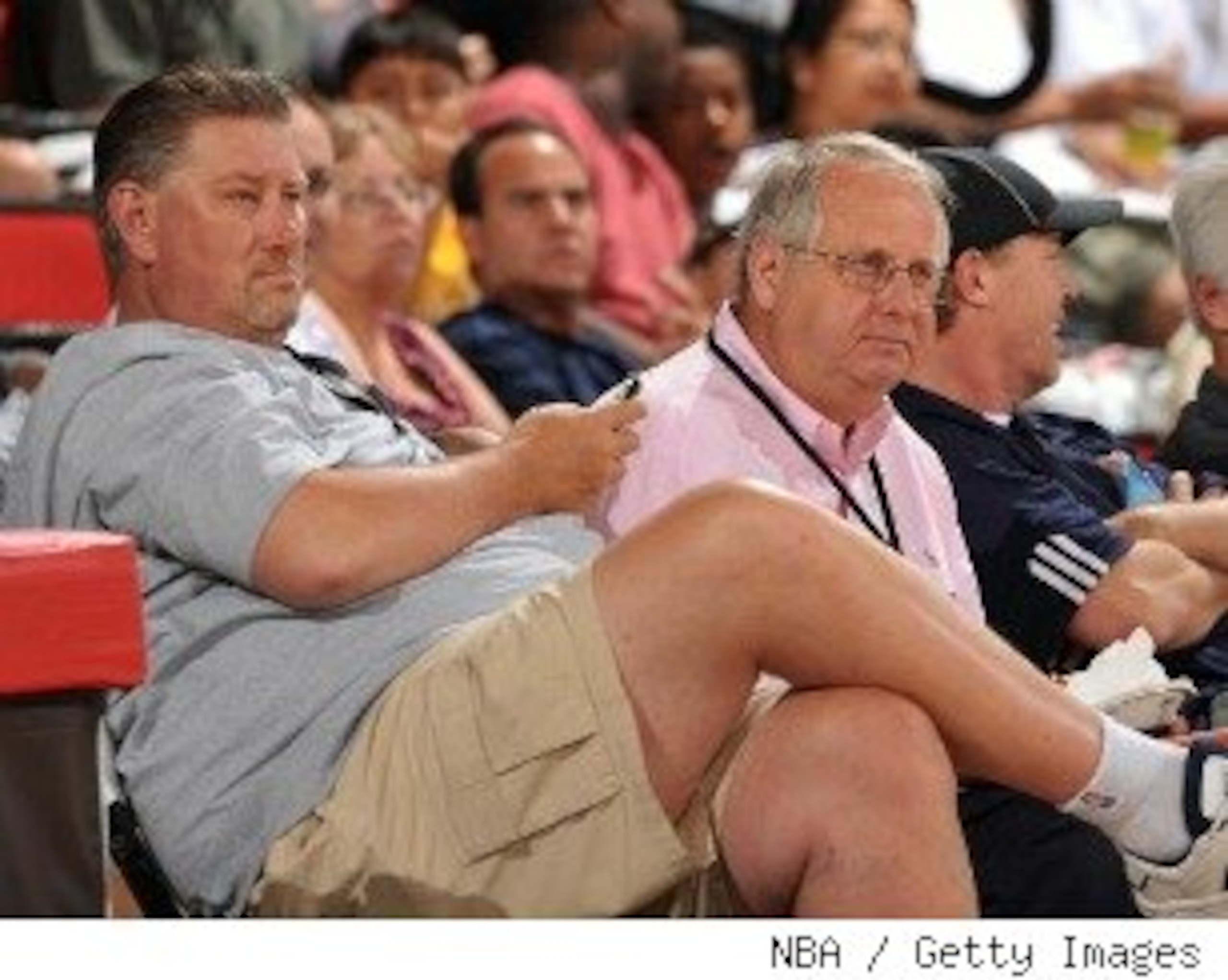 Bearup (left) sits with Warkentien (right) at a Nuggets game.