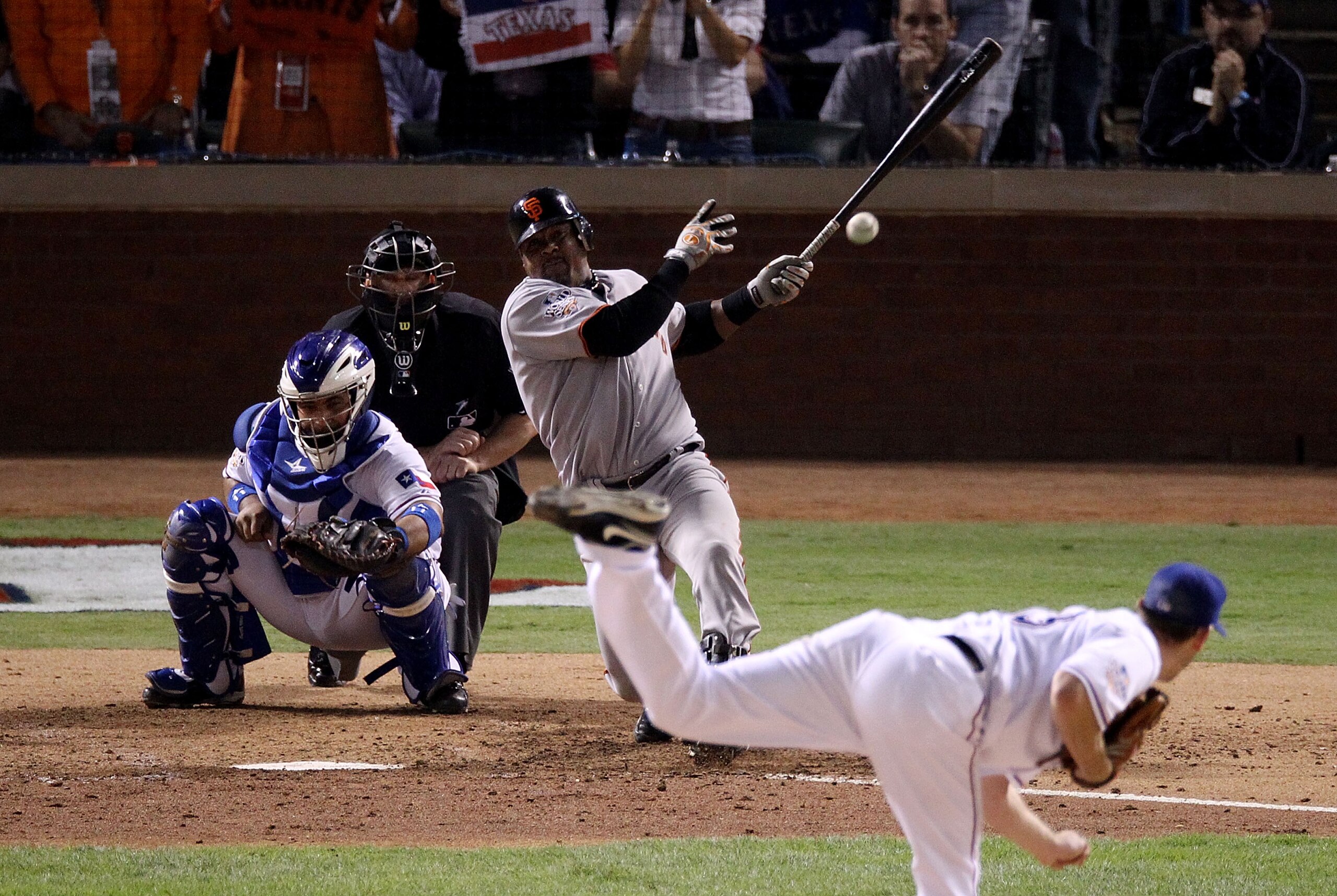 ARLINGTON, TX - NOVEMBER 01:  Juan Uribe #5 of the San Francisco Giants hits a single against starting pitcher Cliff Lee #33 of the Texas Rangers in the seventh inning of Game Five of the 2010 MLB World Series at Rangers Ballpark in Arlington on November 