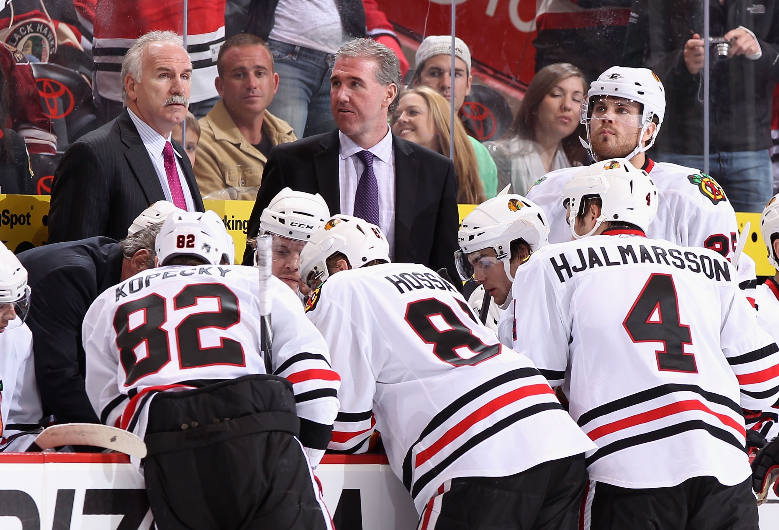 GLENDALE, AZ - FEBRUARY 12:  Head coach Joel Quenneville of the Chicago Blackhawks talks with his team during a time out from the NHL game against the Phoenix Coyotes at Jobing.com Arena on February 12, 2011 in Glendale, Arizona. The Coyotes defeated the