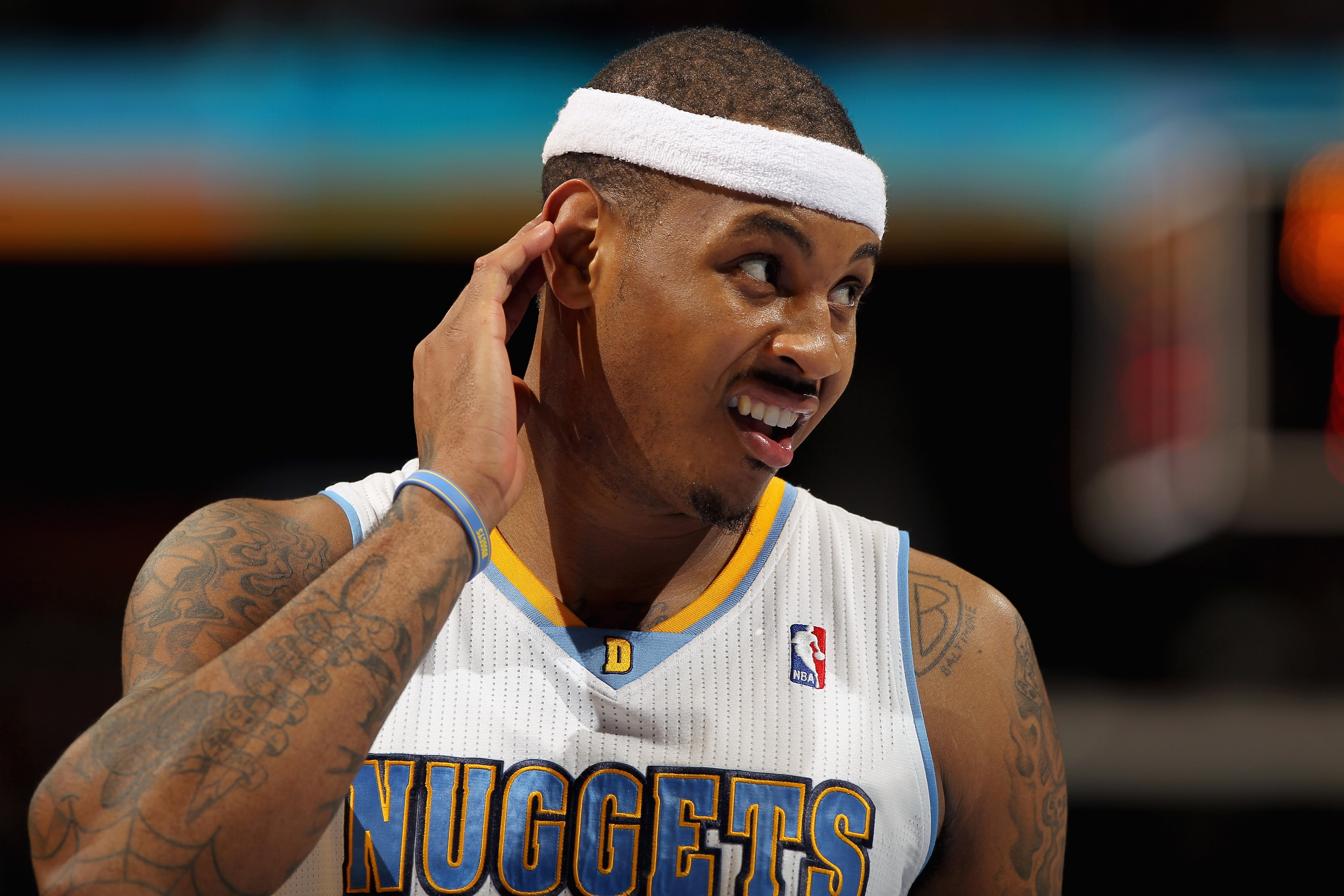 DENVER, CO - FEBRUARY 10:  Carmelo Anthony #15 of the Denver Nuggets looks on during a break in the action against the Dallas Mavericks during NBA action at the Pepsi Center on February 10, 2011 in Denver, Colorado. The Nuggets defeated the Mavericks 121-